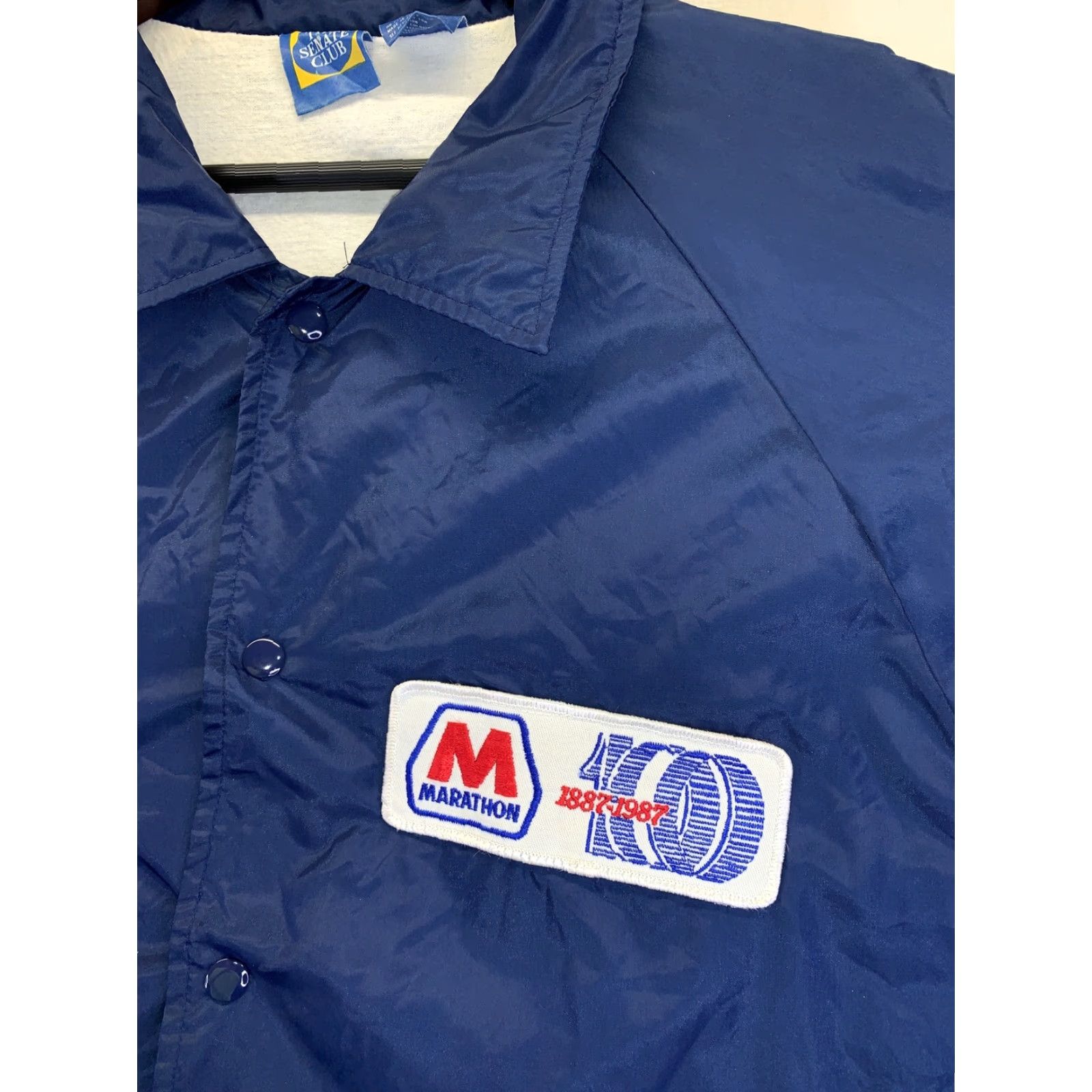 Vintage VINTAGE Senate Club 1987 100yr Anniversary Marathon Gasoline Mens Nylon Cotton Lined Snap Up Blue Windbreaker Style Lightweight Jacket XL Mens Size US XL / EU 56 / 4 - 5 Thumbnail