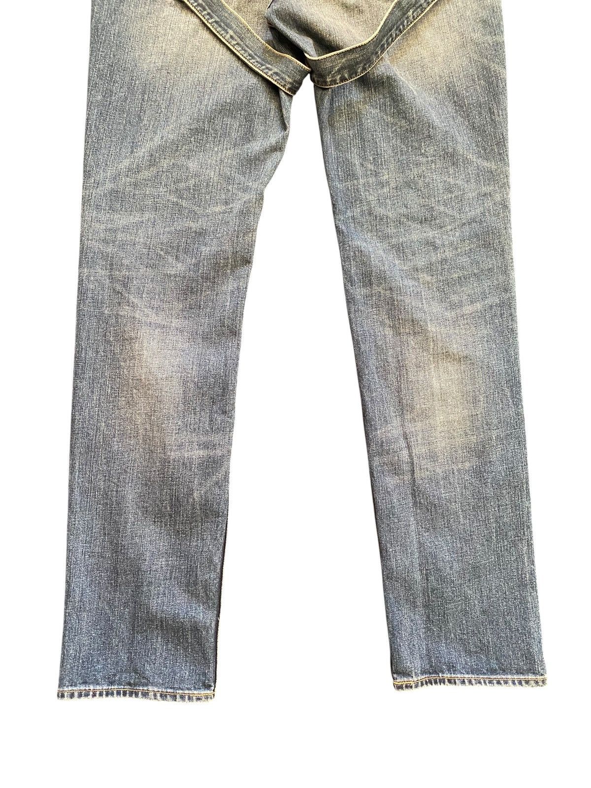 Kim Jones x GU distressed bondage denim