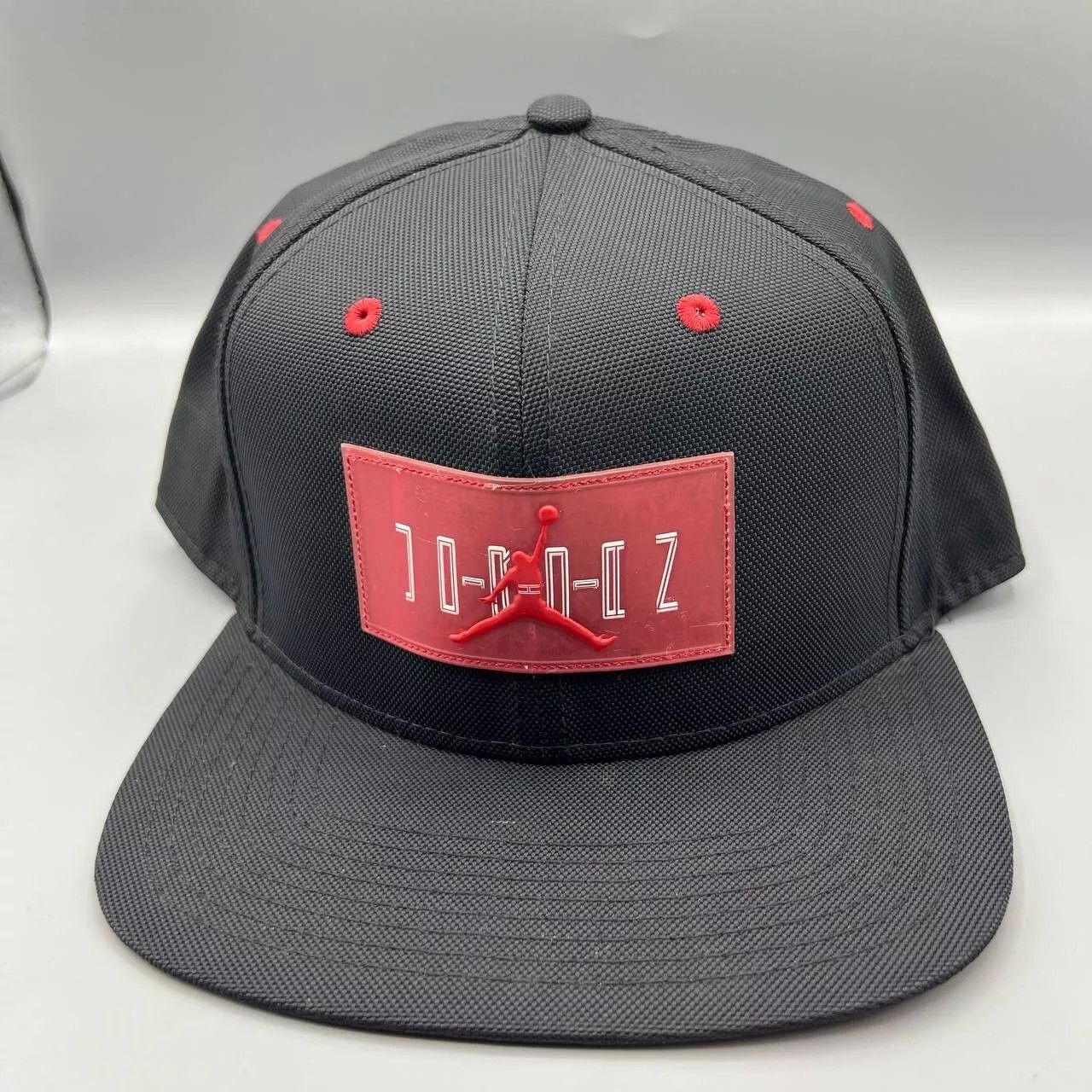 Jordan Brand Air Jordan 11 Hat Men Black Red Jumpman Bred Snap Back Cap Size ONE SIZE - 1 Thumbnail