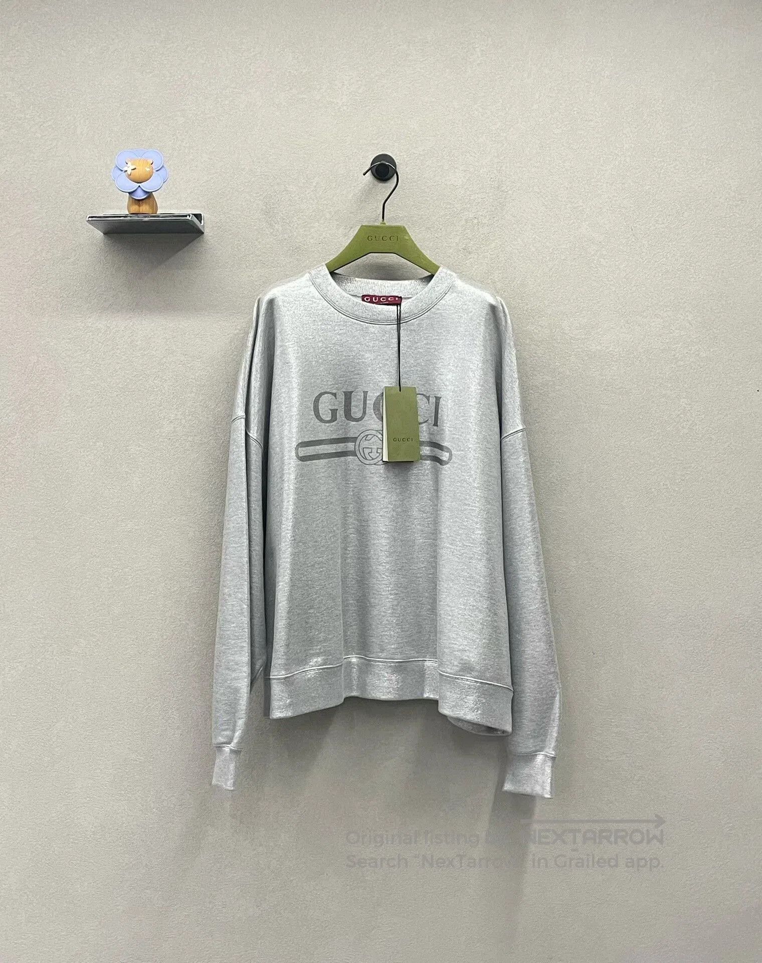 silver logo sweatshirt with gucci branding.