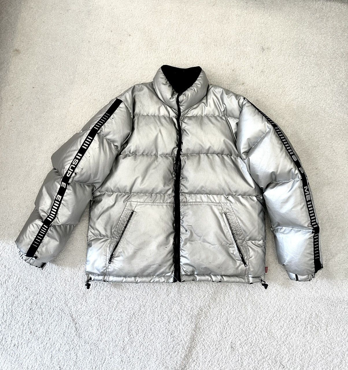 Supreme silver puffer jacket with reflective sleeves