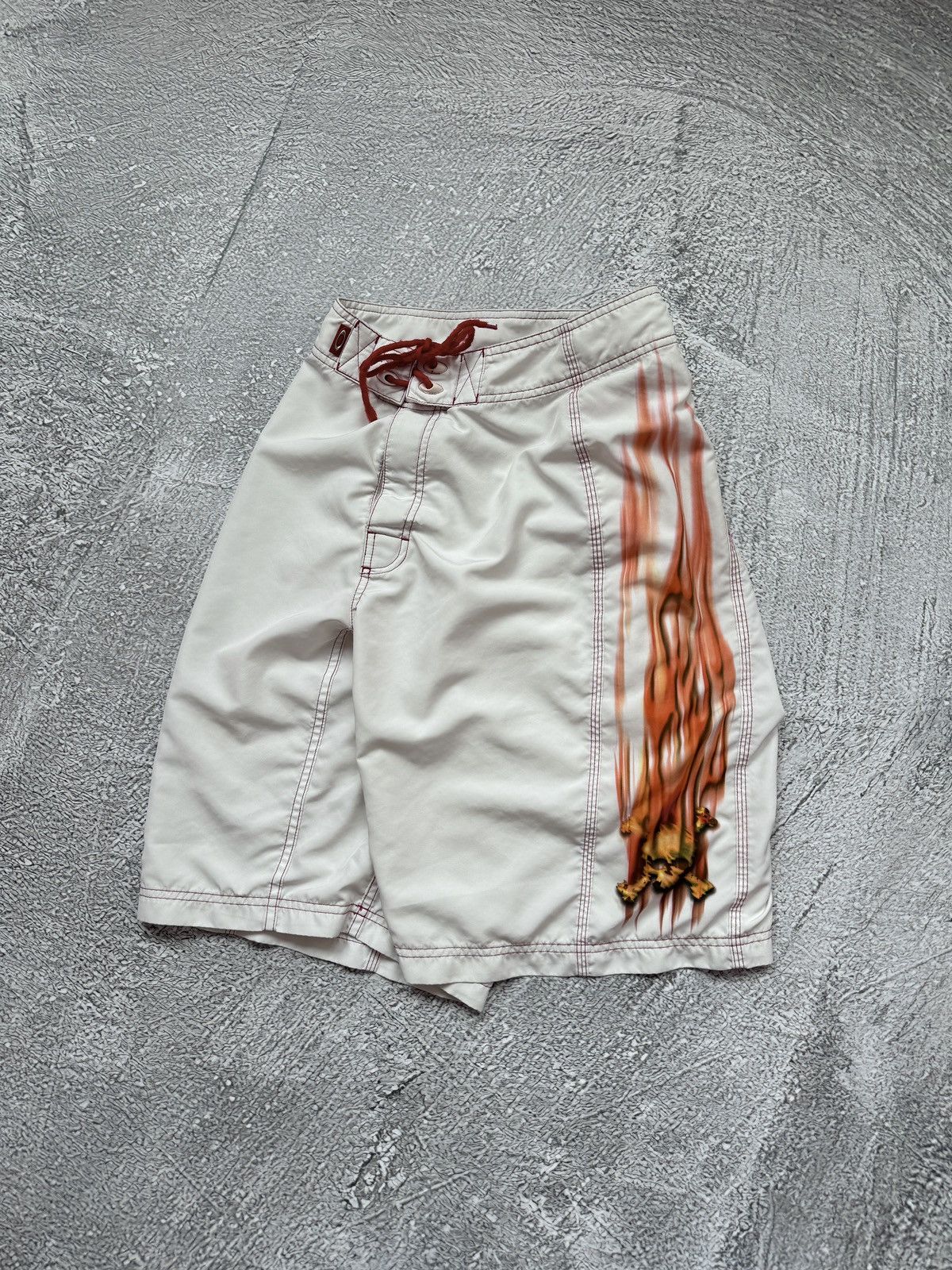 Oakley × Vintage Vintage Oakley Flame Skull Board Shorts 90s | Grailed