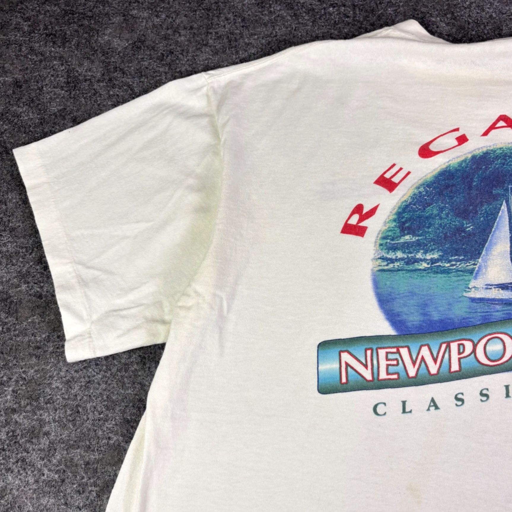 Vintage Vintage Newport Blue Regatta T-Shirt 90s Mens XL Cream Sailboat Graphic User: Vintage Newport Blue Regatta T-Shirt 90s Mens XL Cream Sailboat Graphic Size US XL / EU 56 / 4 - 6 Thumbnail
