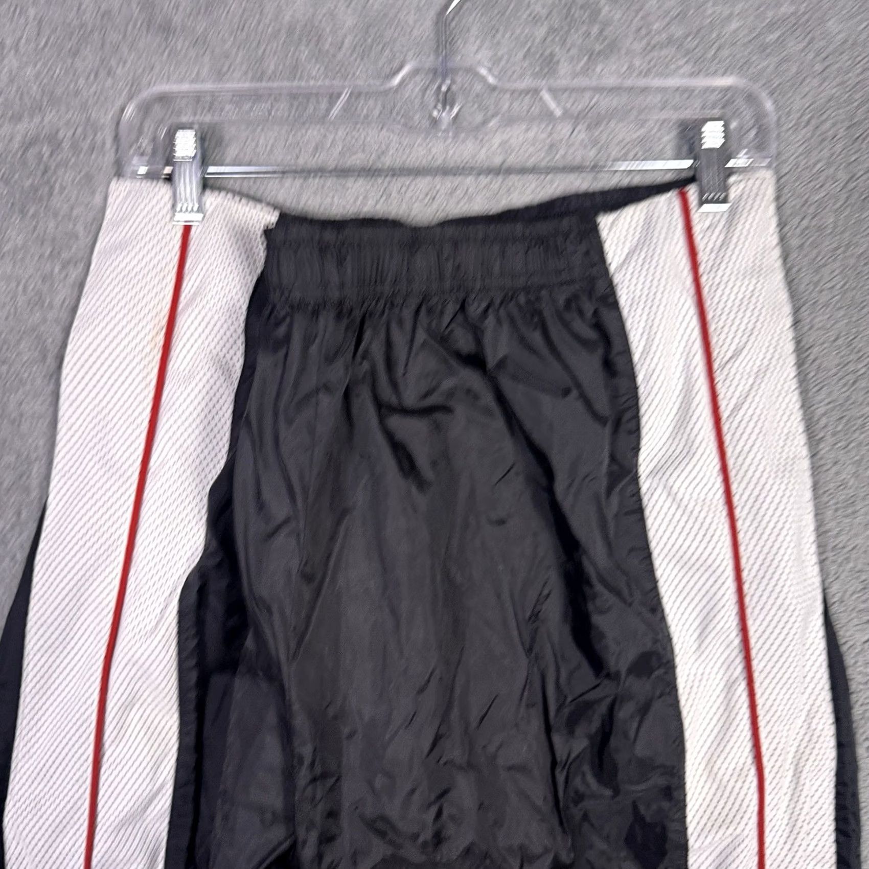 Nike Keywords: "90s Track Pants," "Vintage Nike," "2XL," "Warmup Sweatpant," "Baggy," "Tearaway," "Black" directly address the item’S style and size Size US 39 - 6 Thumbnail