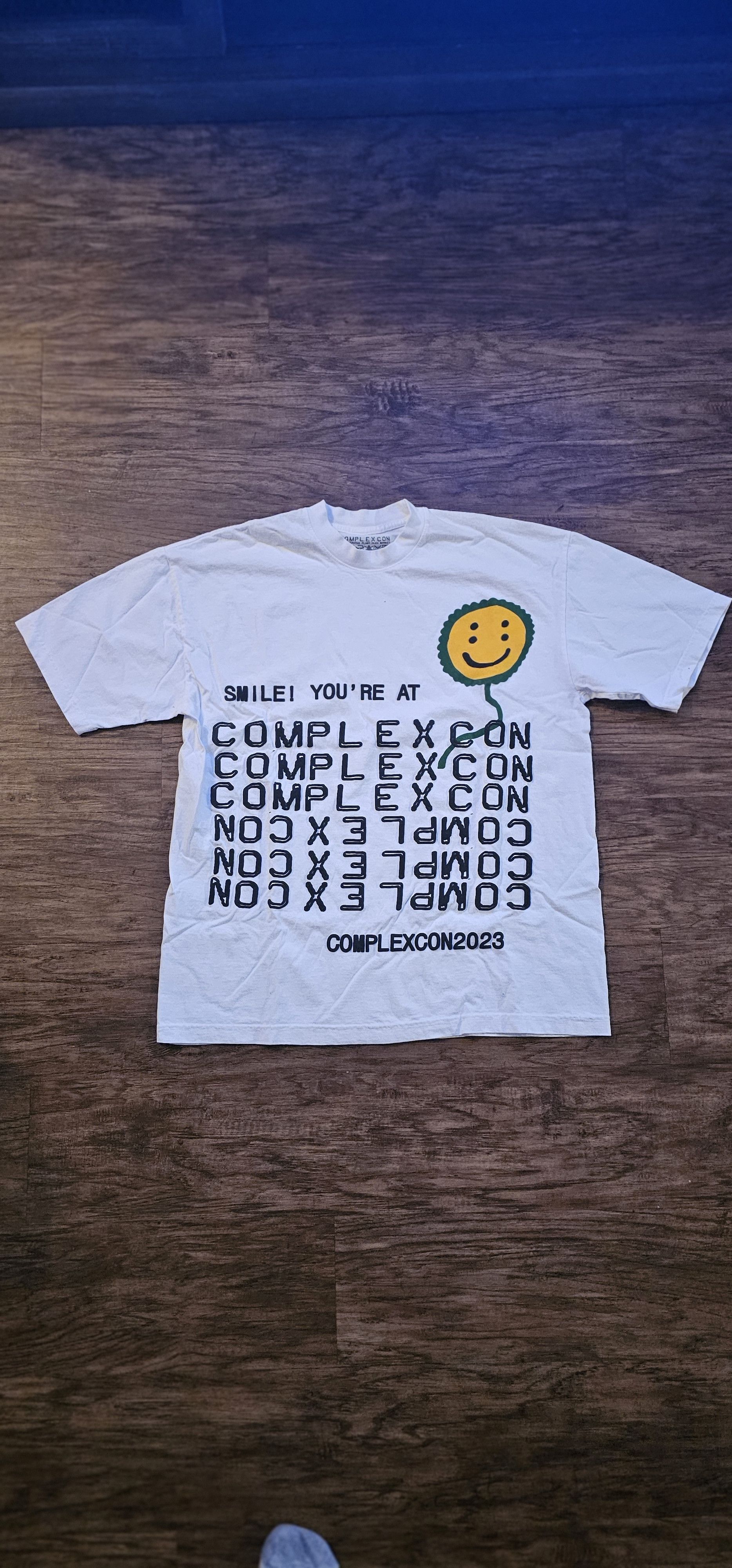 image of Cactus Plant Flea Market x Complexcon Smile Your At Complexcon Tee in White, Men's (Size XL)