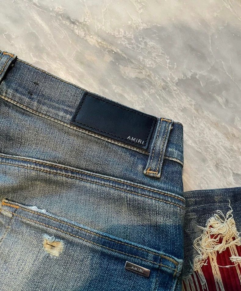 Amiri yellow mud washed blue jeans