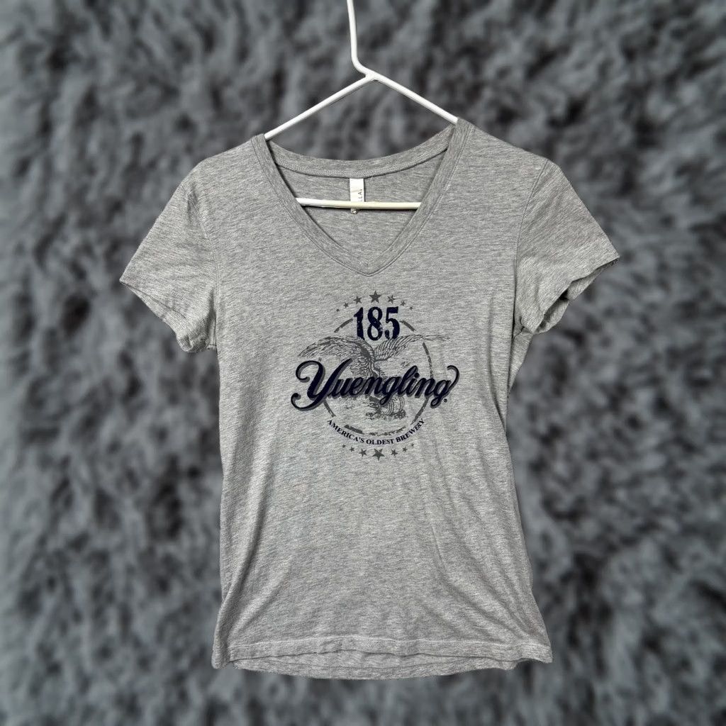 Bell Bella Yuengling Beer Graphic V-Neck T-Shirt L Women Gray Heathered Jersey Short Sleeve Casual 185th Anniversary Licorice/USA Theme Size L / US 10 / IT 46 - 1 Thumbnail