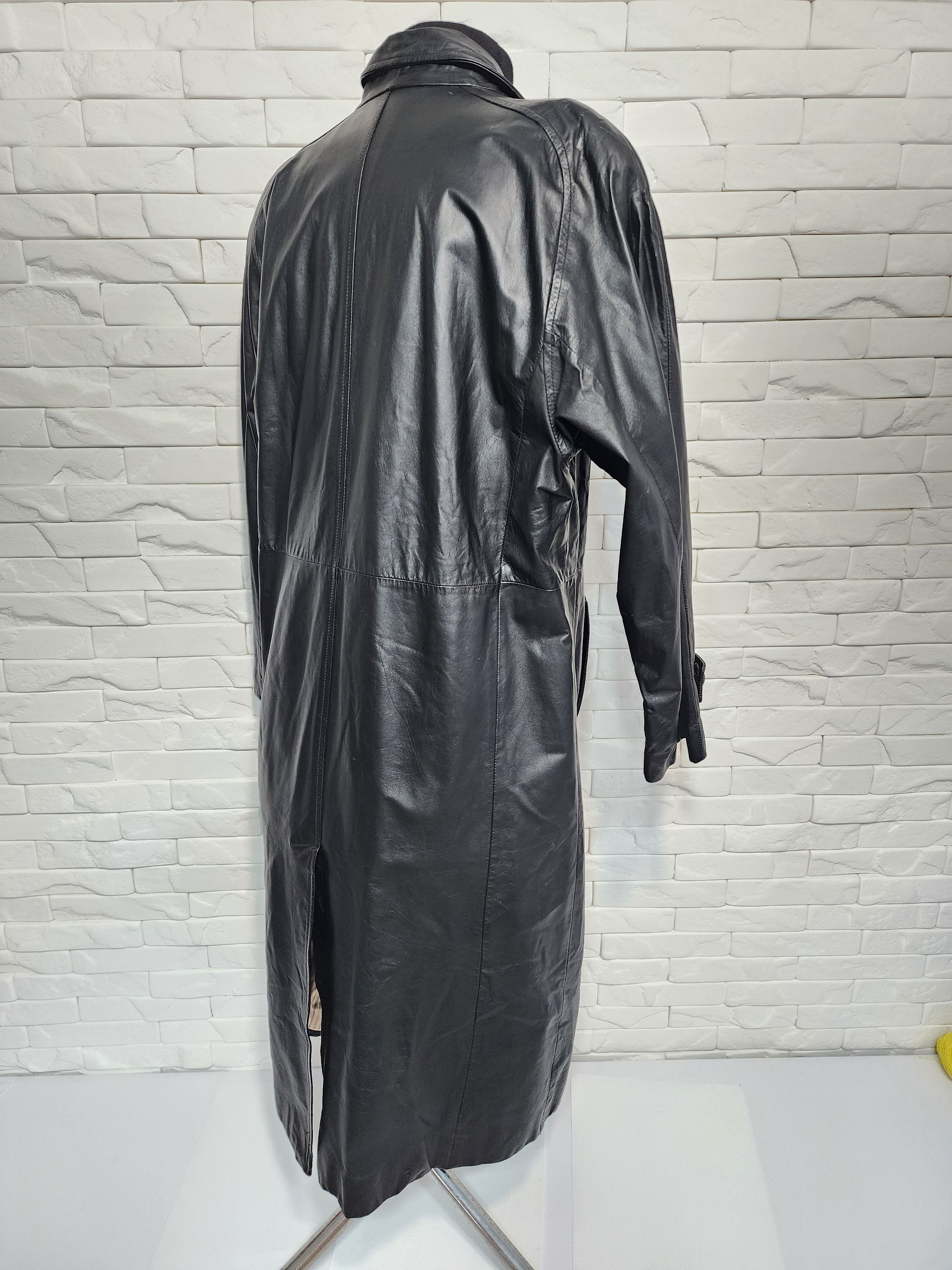 Women black leather raincoat.