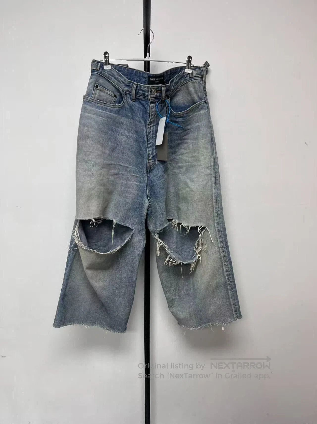 balenciaga skater light blue ripped jeans.