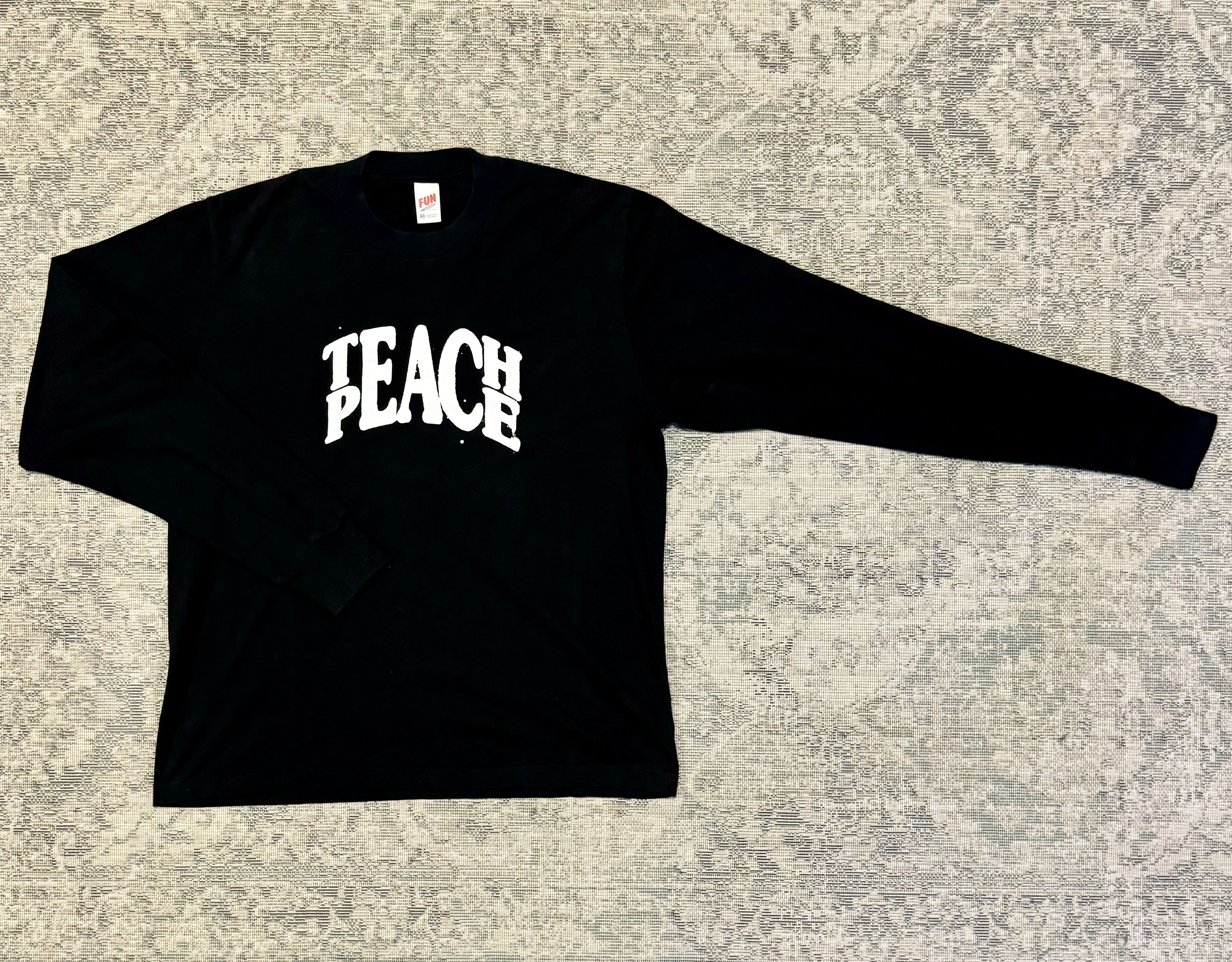 Jjjjound Teach Peace LS Tee - Black | Grailed