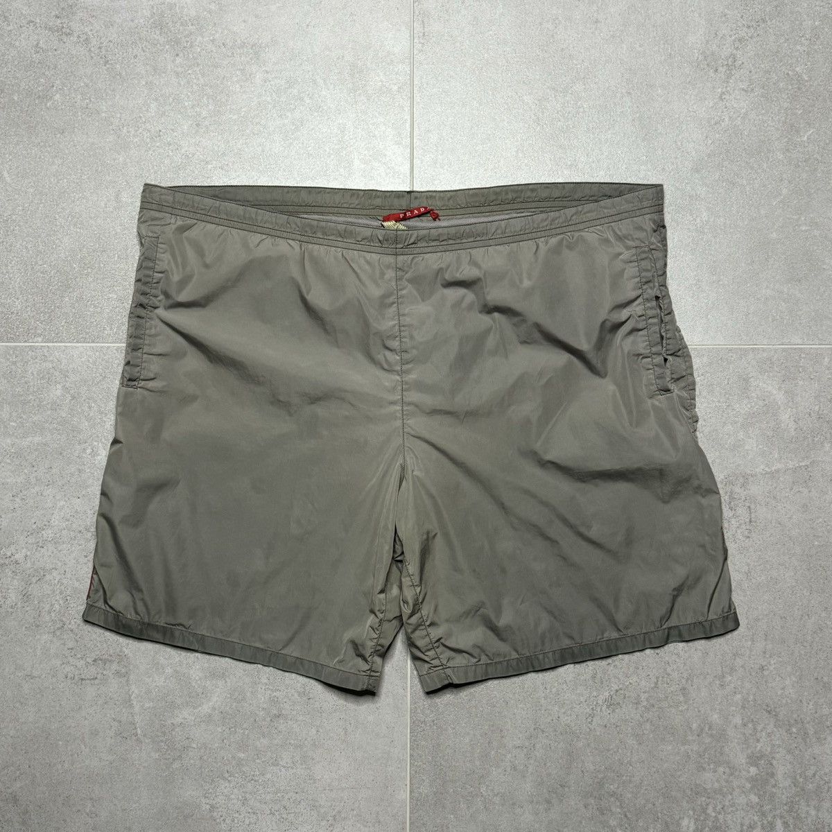 Japanese Brand "Prada Dark Grey Swimmtrunks with Red Tab" Size US 34 / EU 50 - 1 Thumbnail
