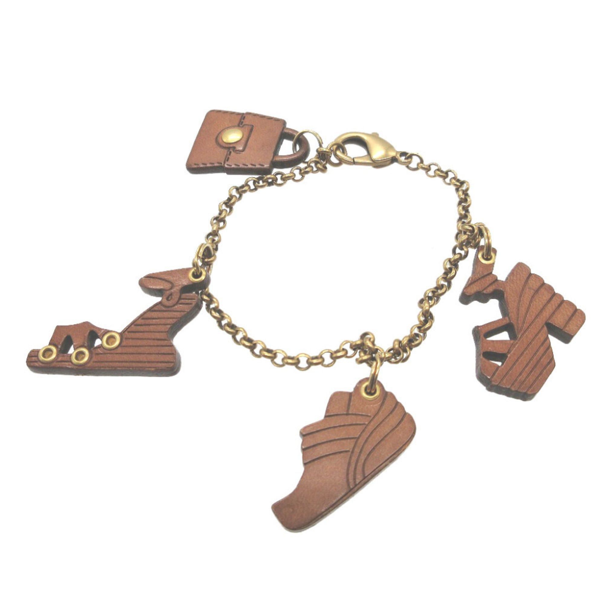 Salvatore Ferragamo Excellent condition Salvatore Ferragamo leather shoes, bag, metal bag charm, brown bracelet, 0019 Size ONE SIZE - 1 Thumbnail