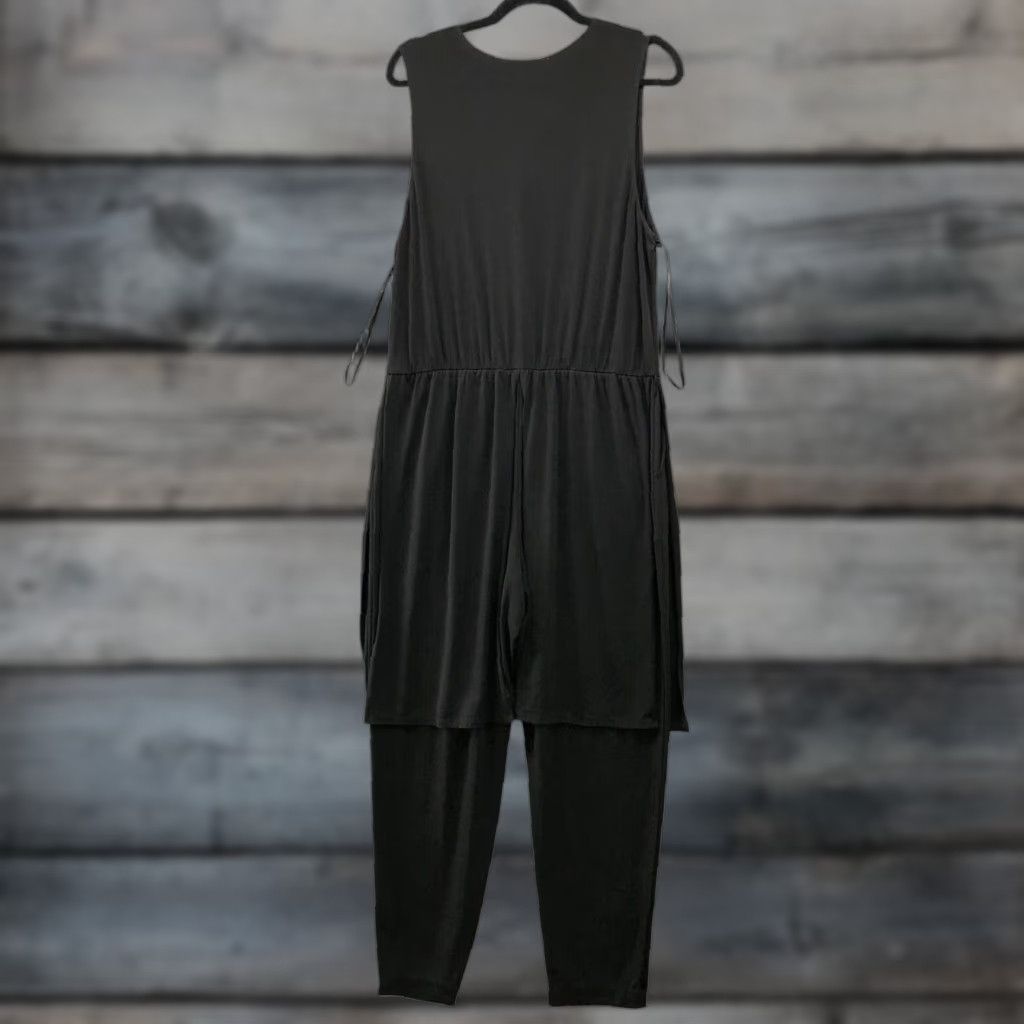 BCBGeneration **Womens Black V-Neck Jersey Knit Sleeveless Jumpsuit** User: **Womens Black V-Neck Jersey Knit Sleeveless Jumpsuit** Size L / US 10 / IT 46 - 1 Thumbnail