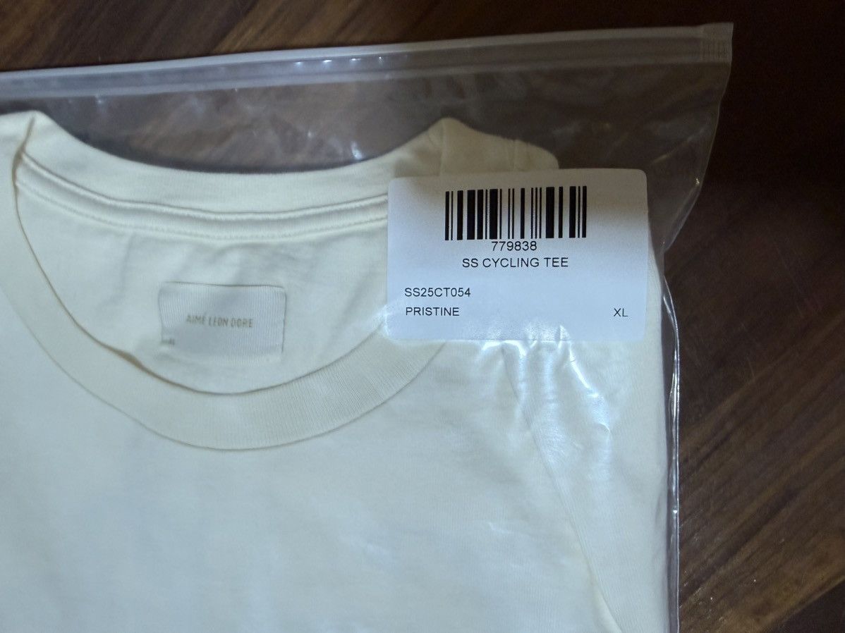 Aime Leon Dore Aime Leon Dore ALD Cycling Logo Tee in Pristine (Cream) XL Size US XL / EU 56 / 4 - 8 Thumbnail