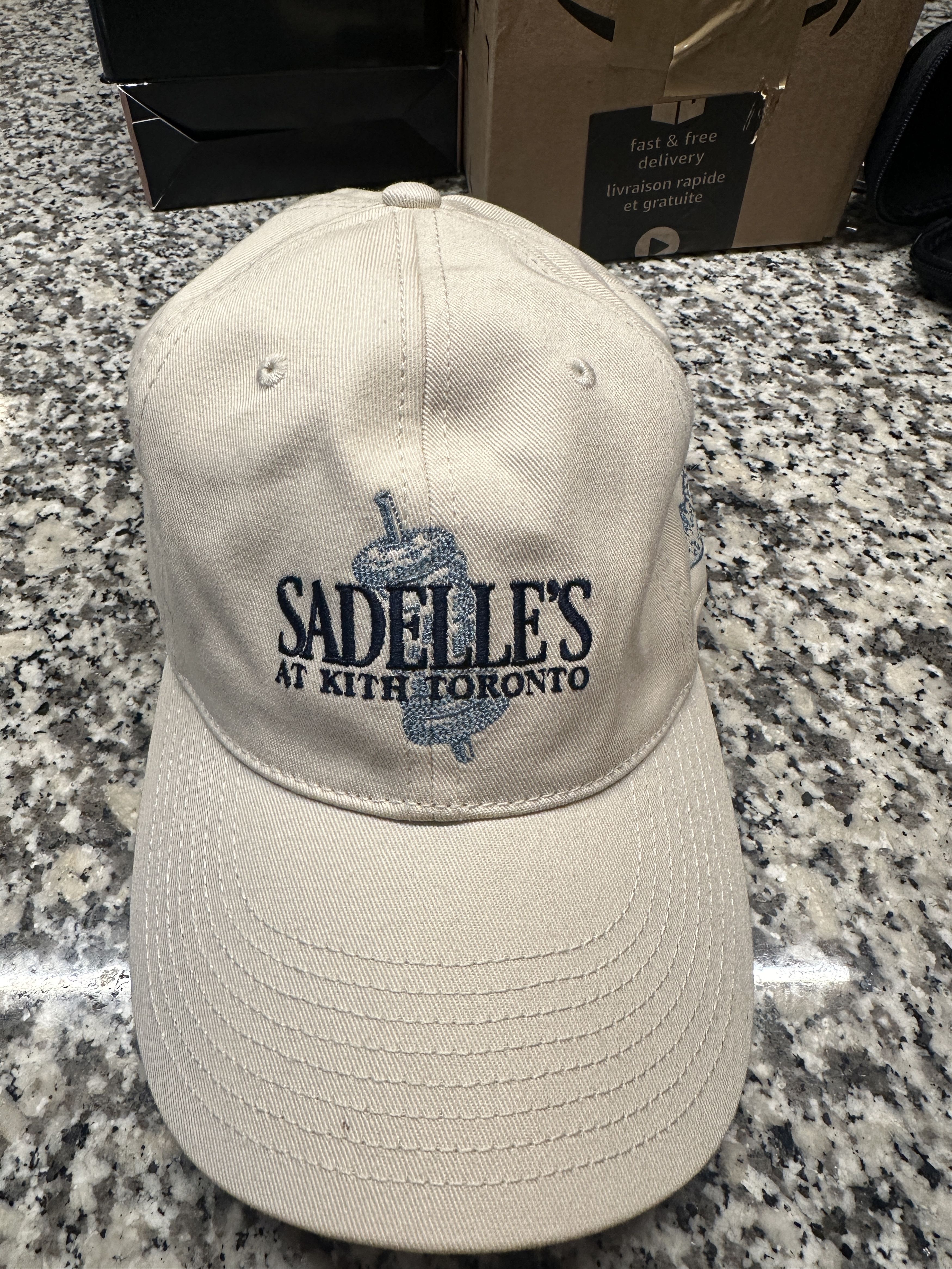 image of Kith Sadelles Toronto Hat in White, Men's