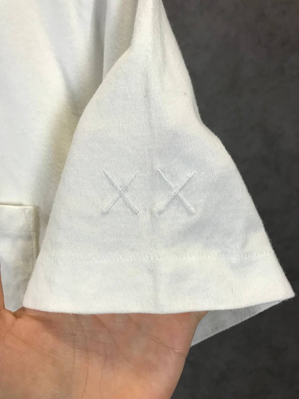 Kaws × Peanuts × Uniqlo Kaws x Peanuts x Uniqlo pocket designer tee Size US M / EU 48-50 / 2 - 6 Thumbnail