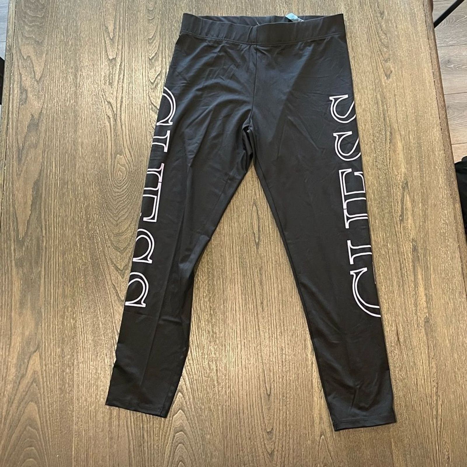 Guess NWOT Guess Black Cropped Capri Leggings Logo Print Size L Size 31" - 1 Thumbnail