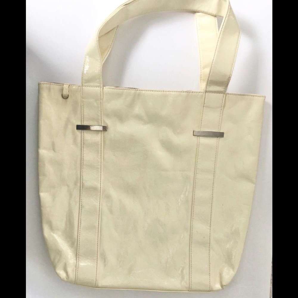 Cream hobo bag with silver plates on straps