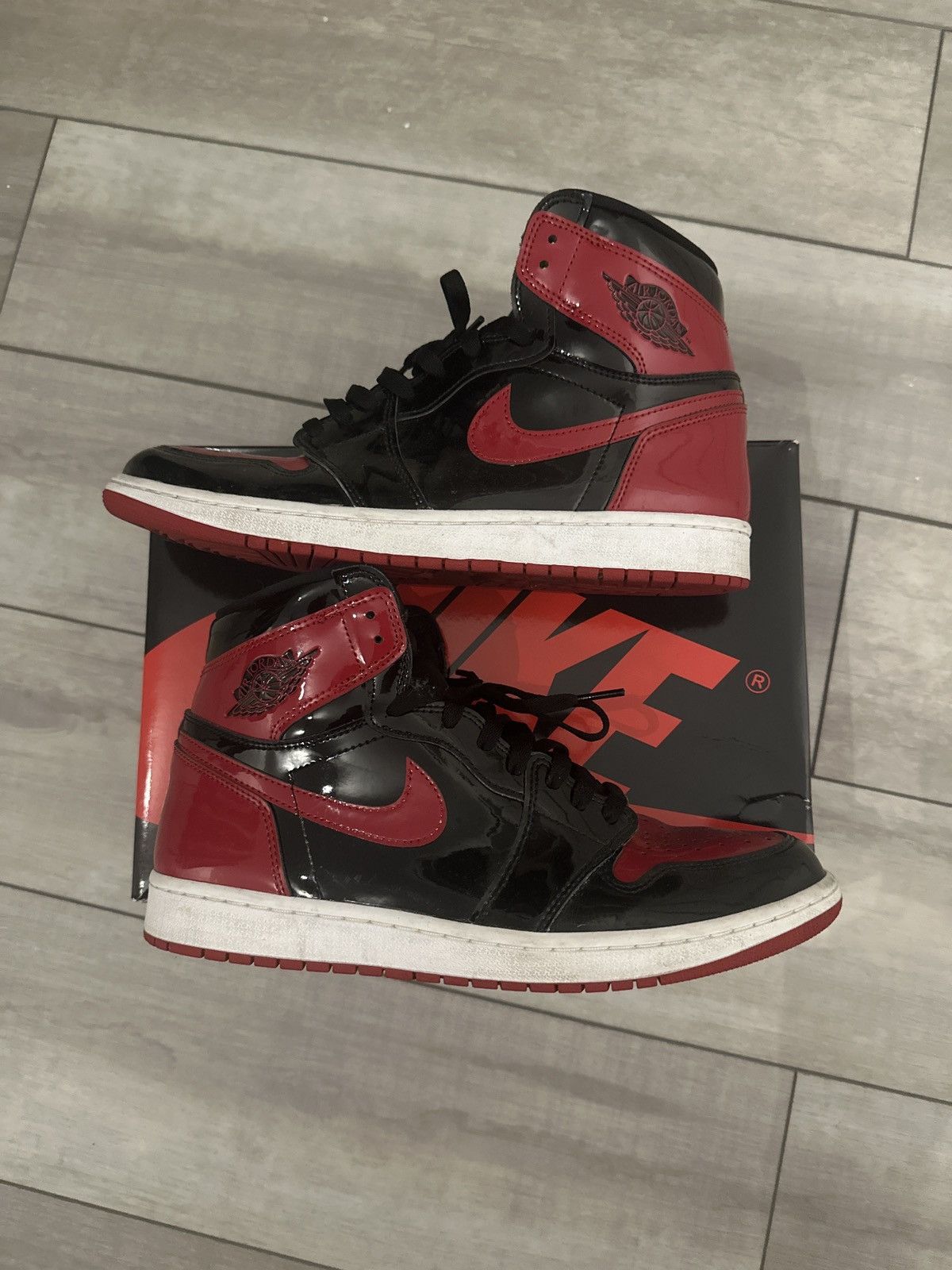 image of Shiny Black/red Jordan 1 Shoes, Men's (Size 12)