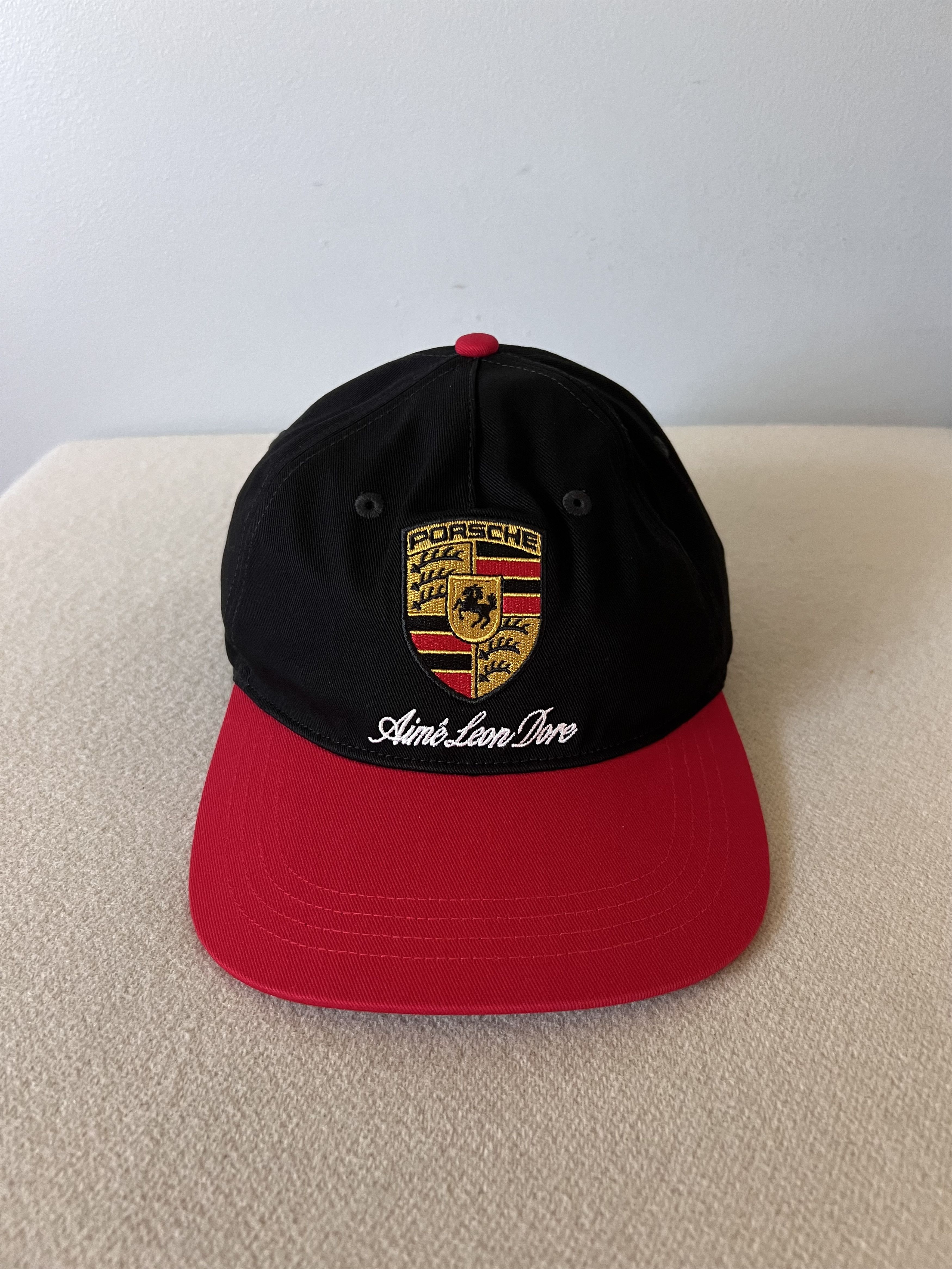Aime Leon Dore × Porsche Design Aime Leon Dore Porsche Colorblock Logo Hat in Black Red Size ONE SIZE - 1 Thumbnail