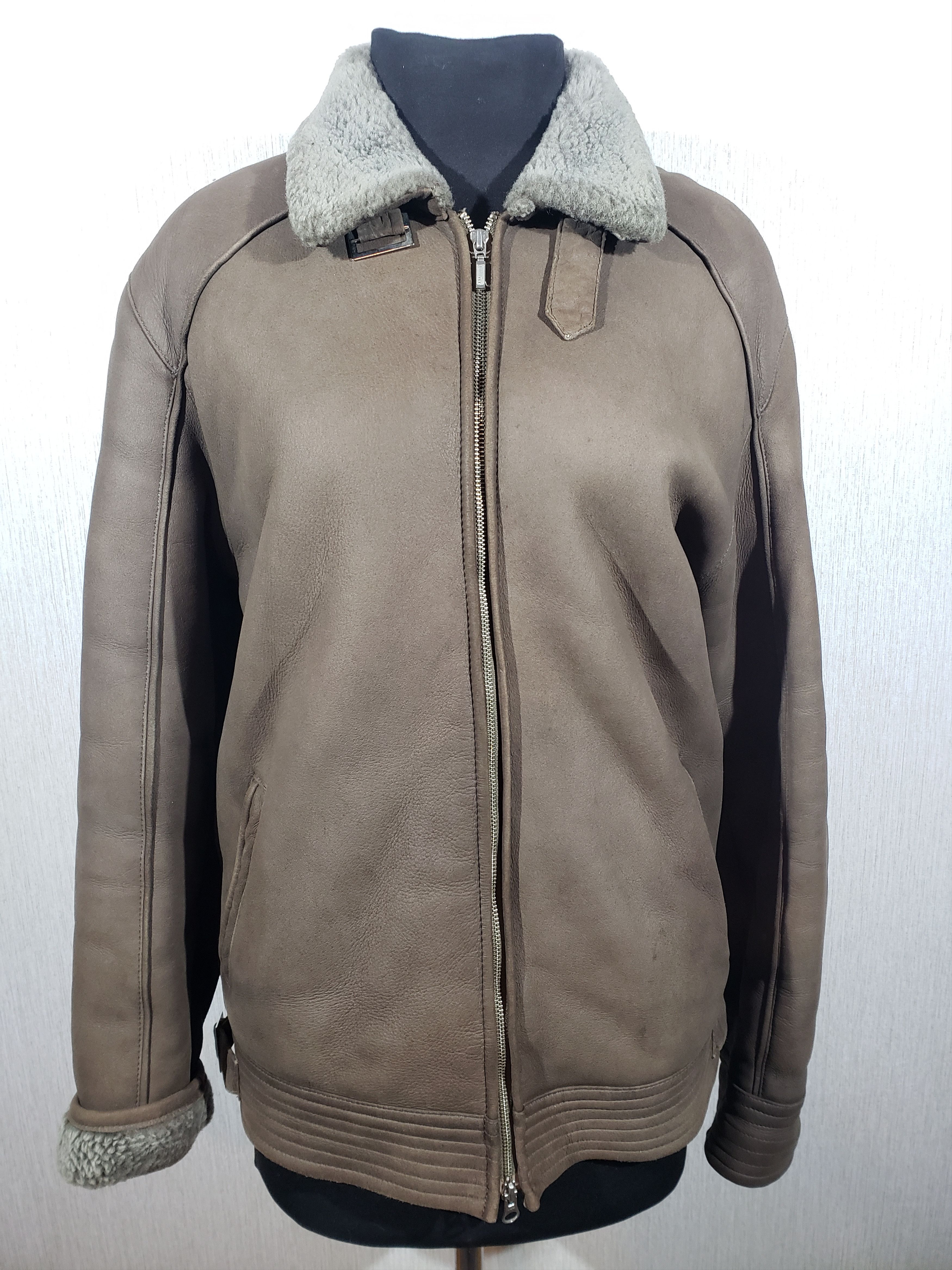 Men's brown sheepskin coat with a metal zipper.
