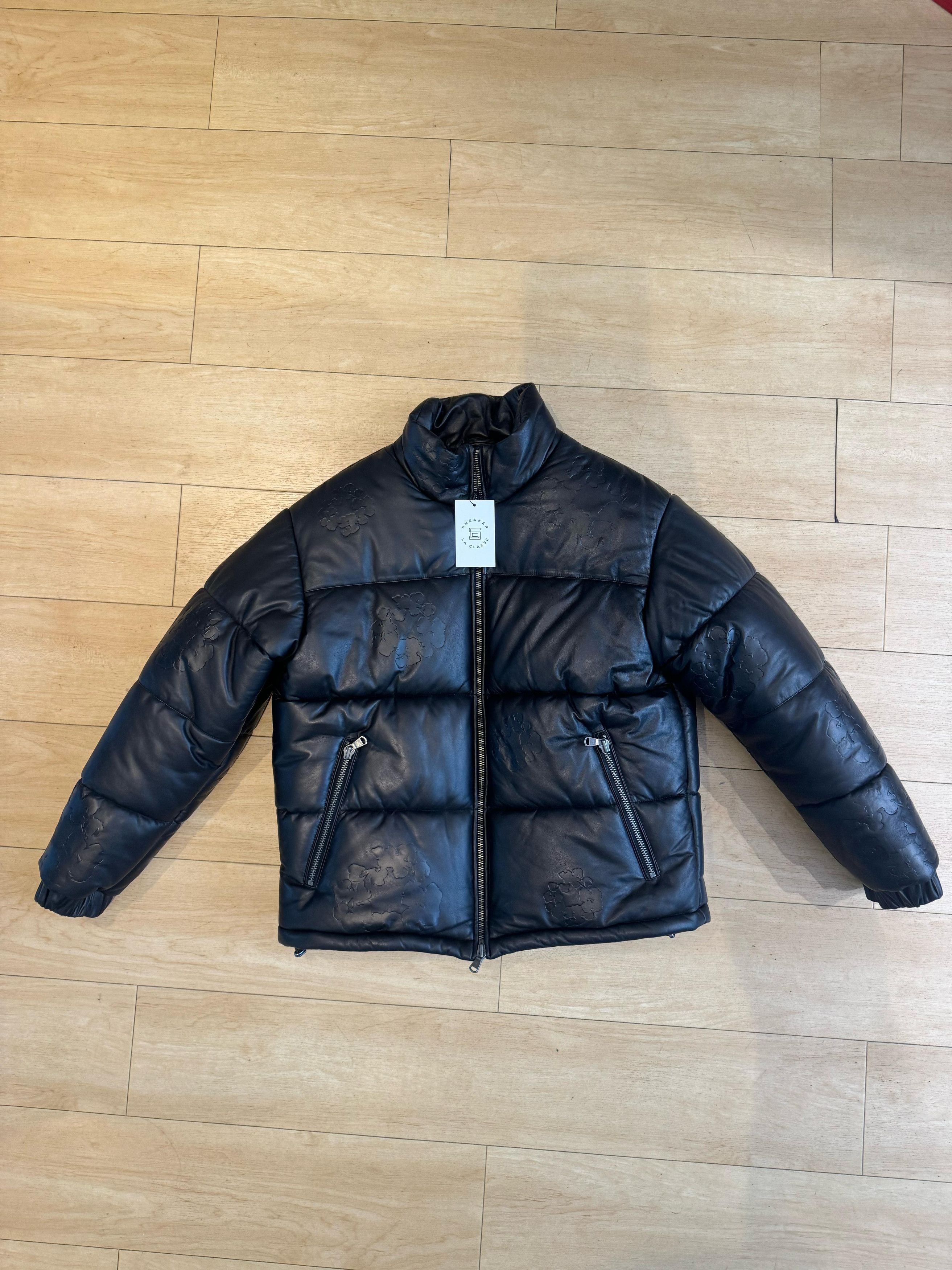 DENIM TEARS Denim Tears Leather Embossed Wreath Puffer Jacket