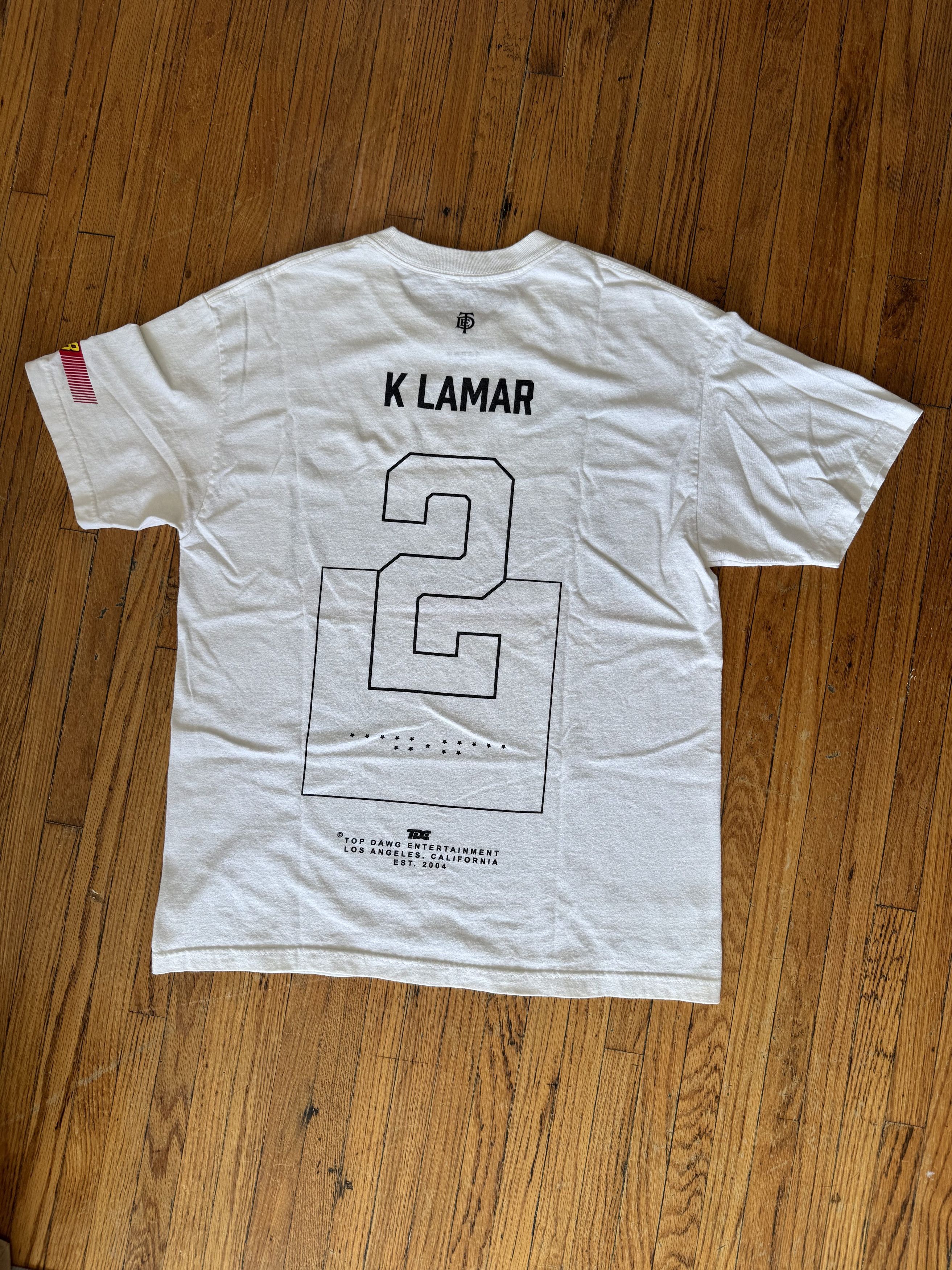 Kendrick Lamar Kendrick Lamar TDE Championship Tour Racing Tee White Size L Size US L / EU 52-54 / 3 - 4 Thumbnail