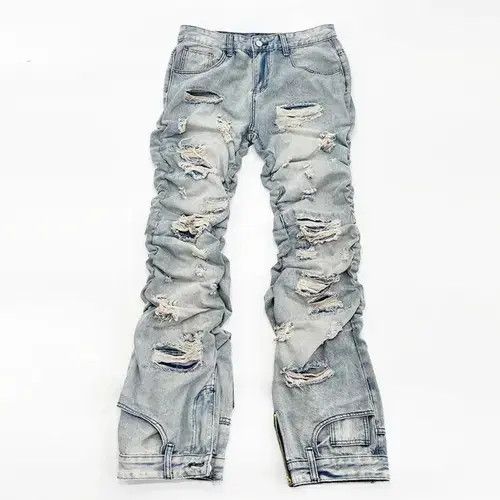 Long ripped inverted jeans with pleats