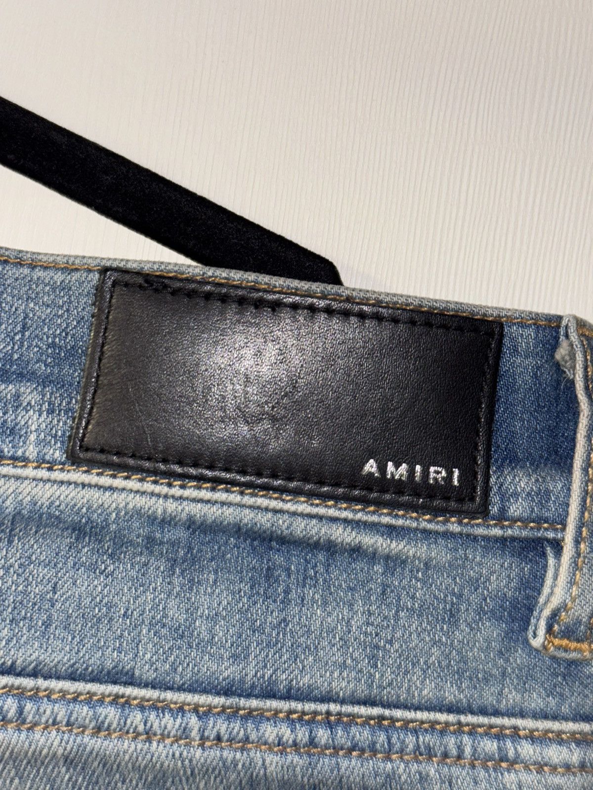 AMIRI BLUE DISTRESSED JEANS