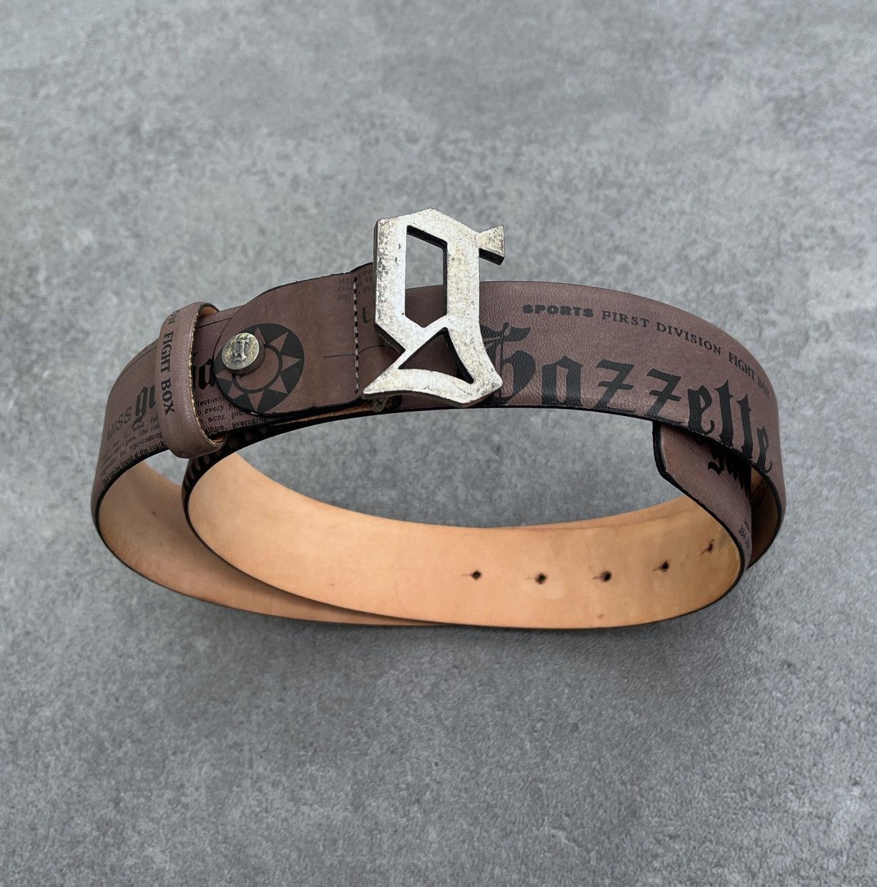 John Gailiano leather belt archive