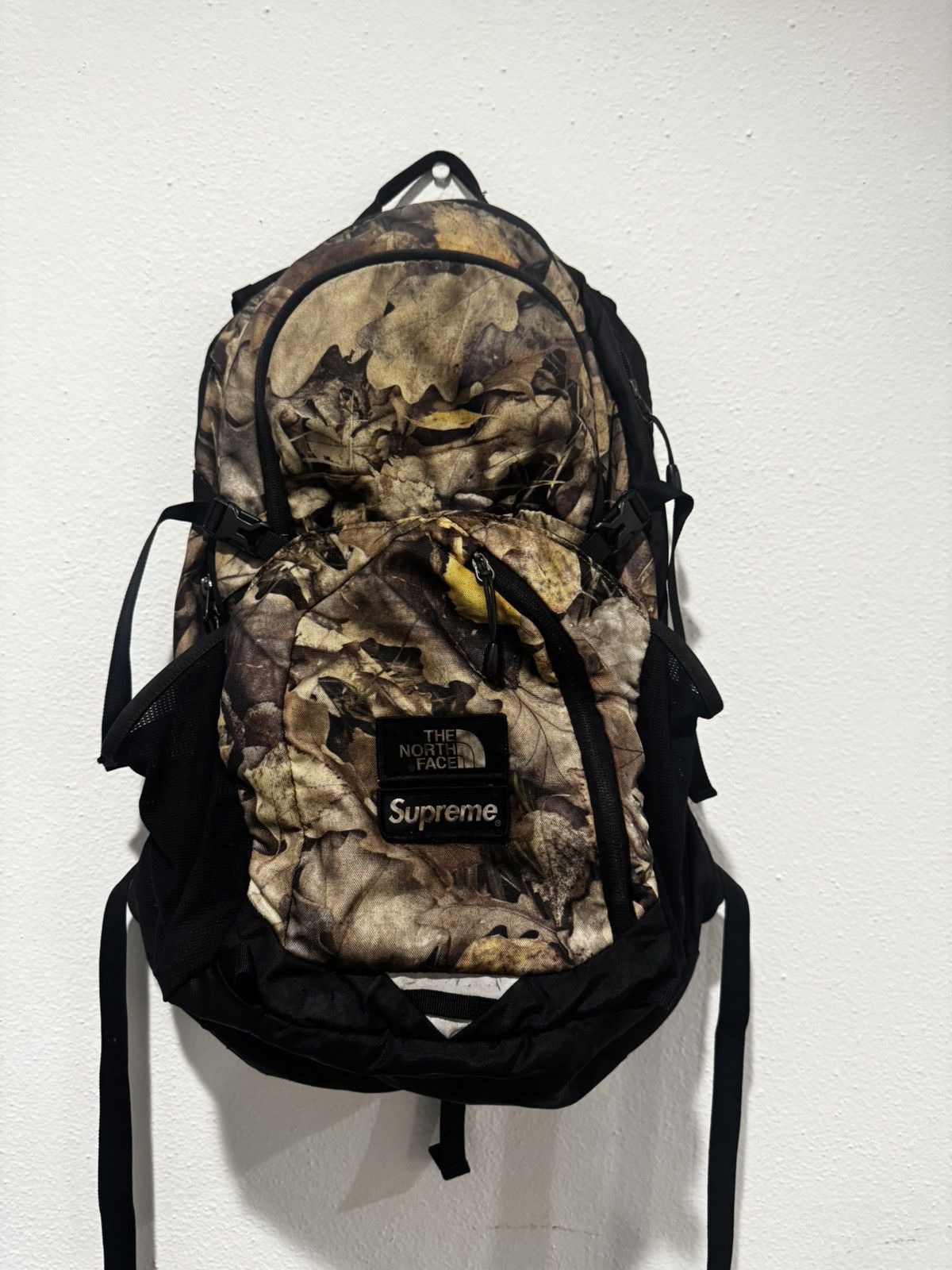 Supreme north face camo backpack deals