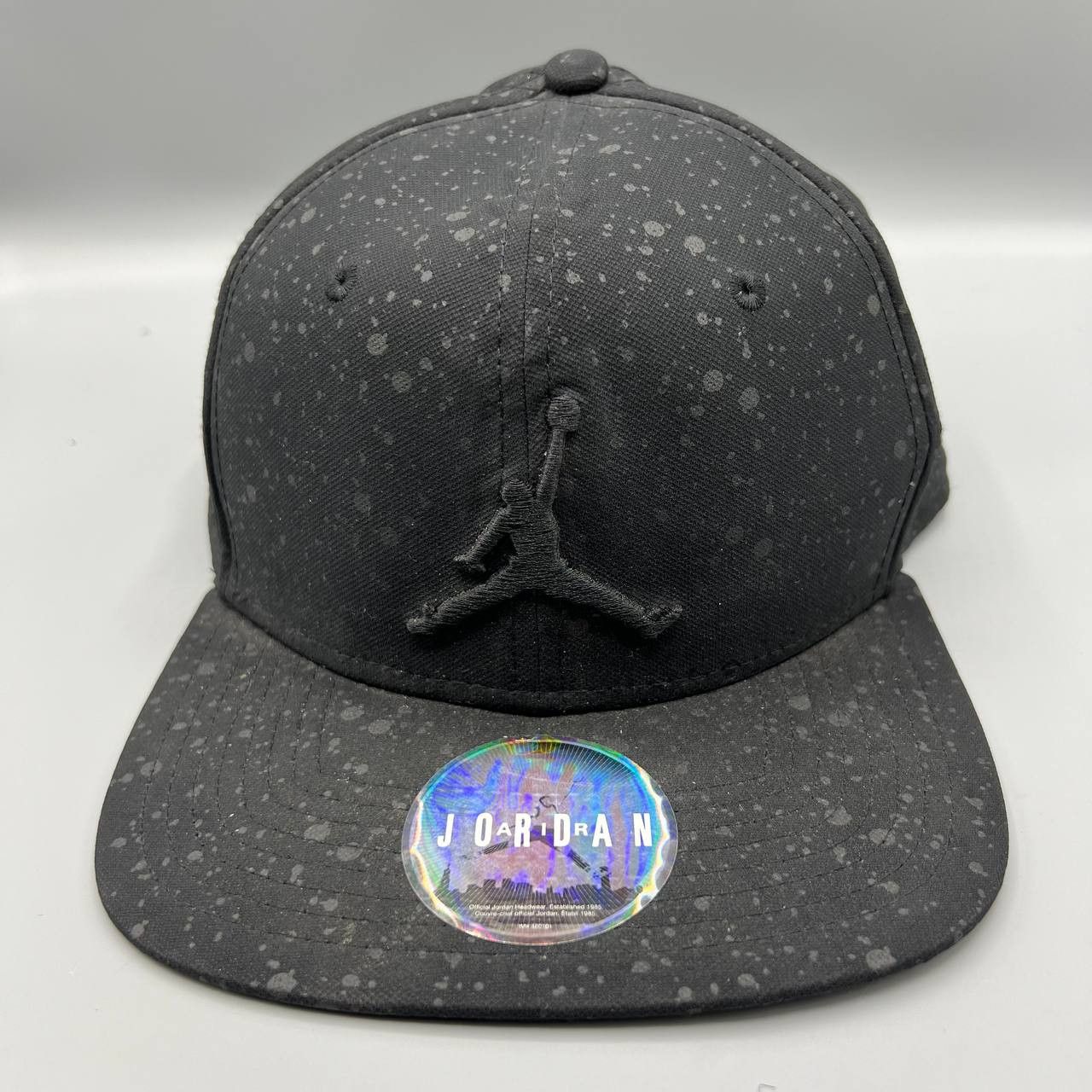 Jordan Brand Air Jordan Hat Men Black Speckle Print Jumpman Snap Back Cap Size ONE SIZE - 1 Thumbnail