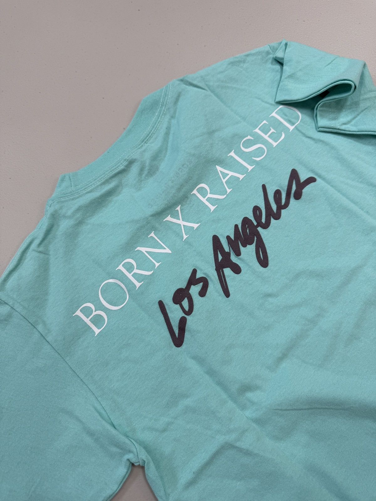 Born X Raised BORN X RAISED ON THE TURF BXR LA TEE TEAL Size L Size US L / EU 52-54 / 3 - 5 Thumbnail