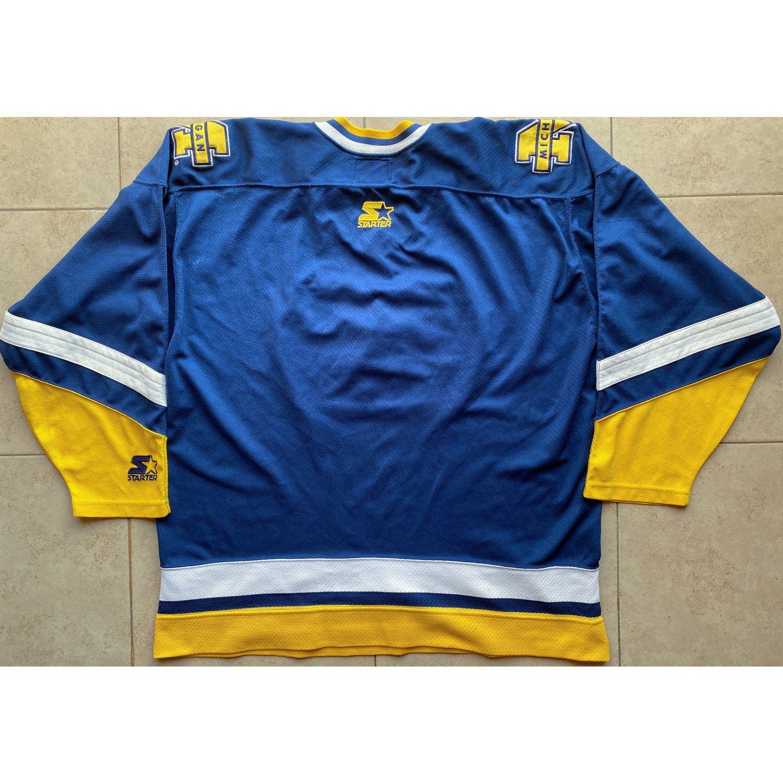 NCAA × Starter Michigan 90s STARTER Hockey jersey L navy gold NCAA vintage Size US L / EU 52-54 / 3 - 4 Thumbnail
