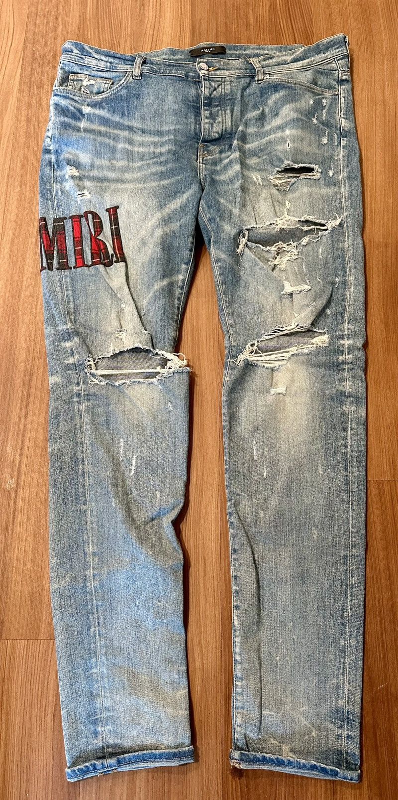 Amiri red flannel core patch appliqué logo jeans 38