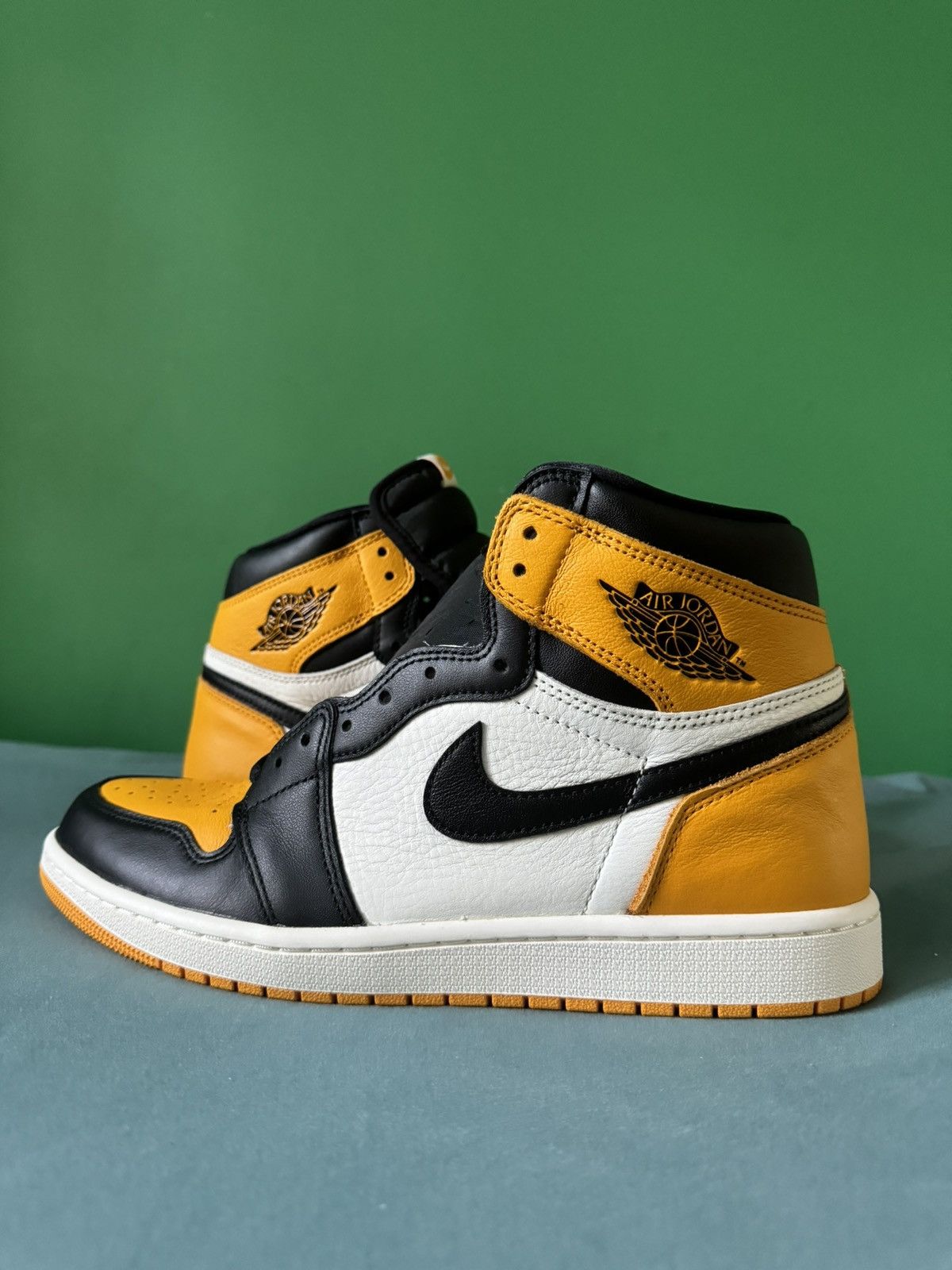 image of Nike Air Jordan 1 High Taxi 2022 Shoes in Orange, Men's (Size 11)