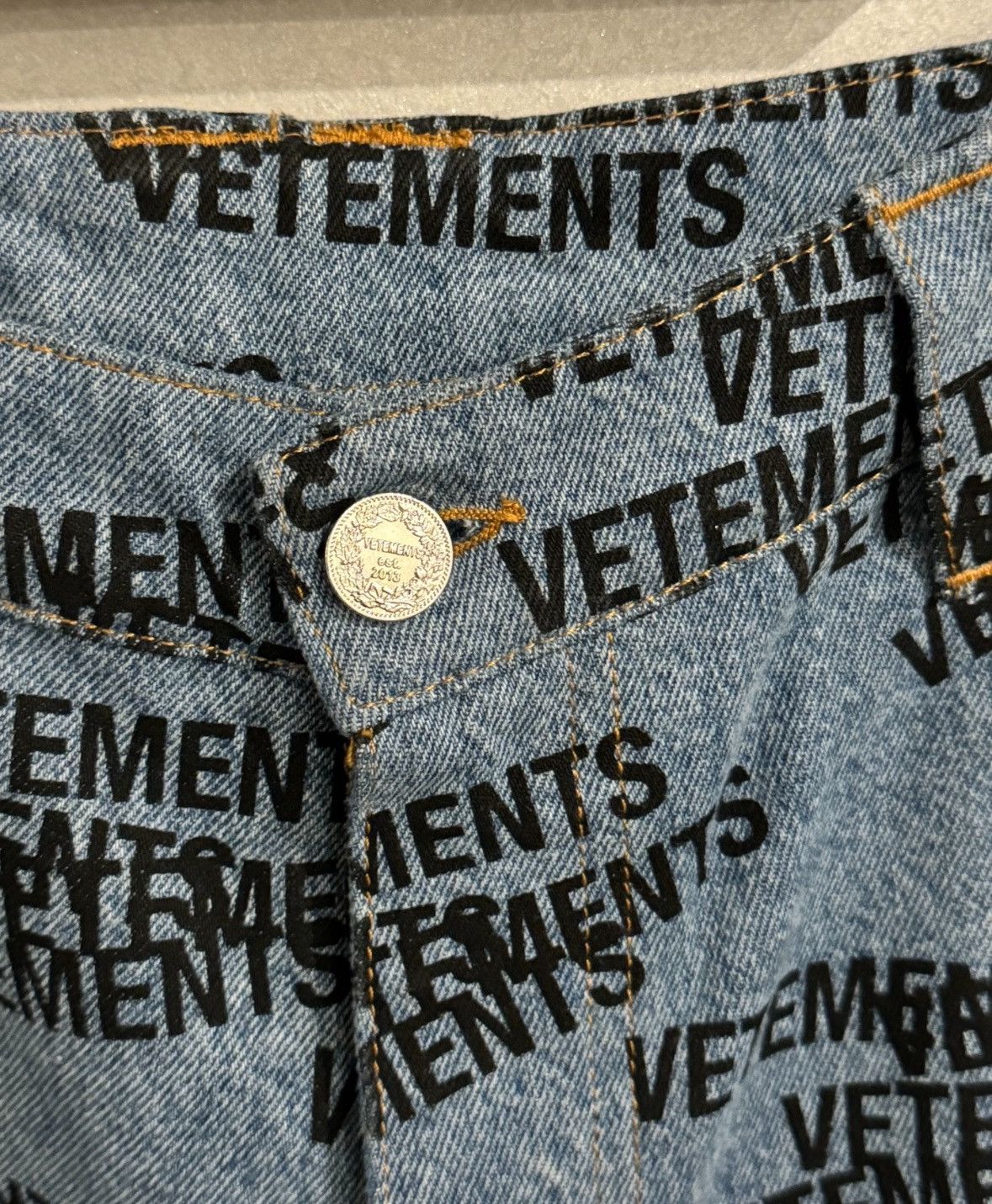 All over stamped logo transformer jeans