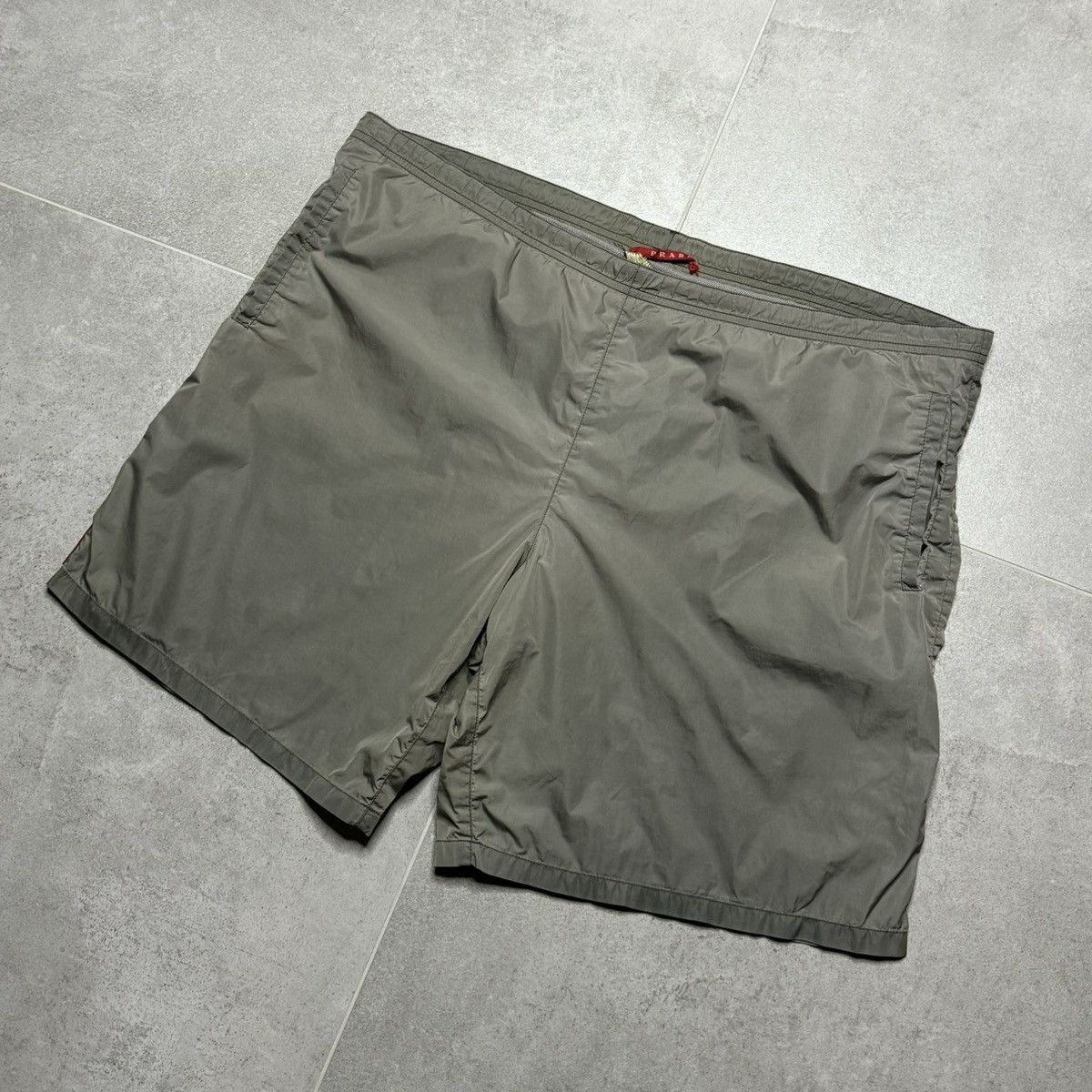Japanese Brand "Prada Dark Grey Swimmtrunks with Red Tab" Size US 34 / EU 50 - 2 Thumbnail