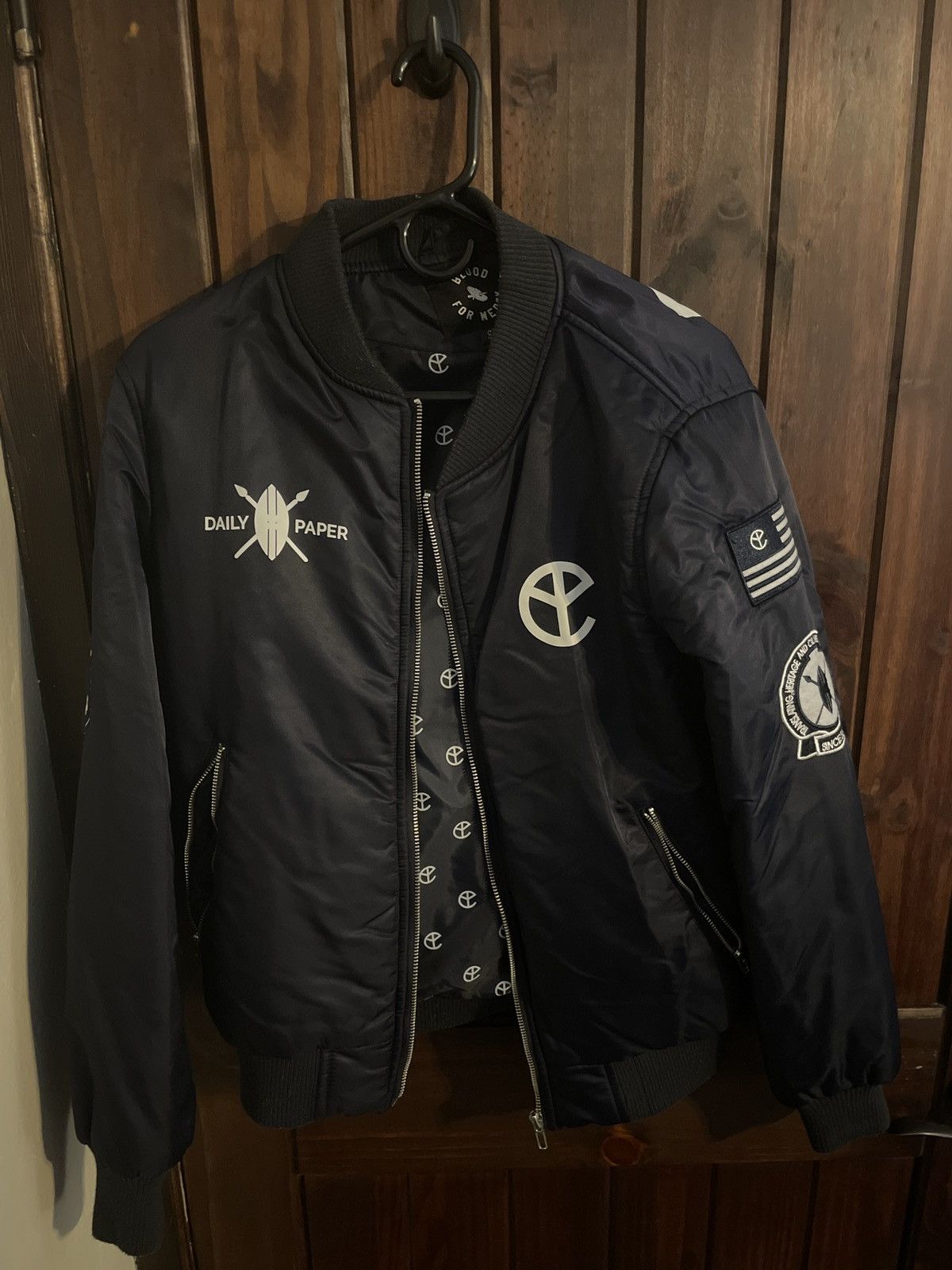 Daily Paper Yellow claw blood for mercy bomber (navy) | Grailed