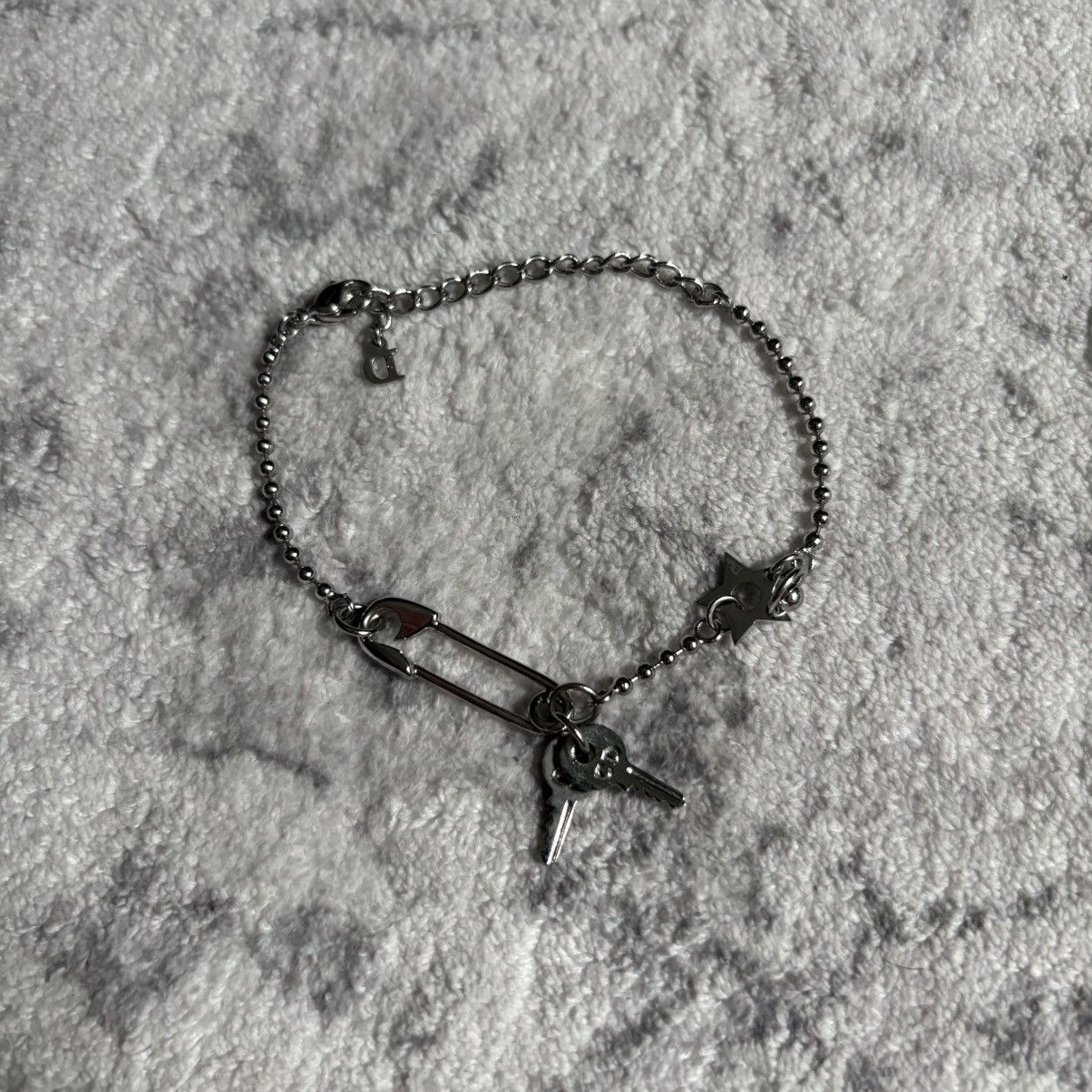 Dior Dior baby dior multi charm .925 silver logo bracelet | Grailed