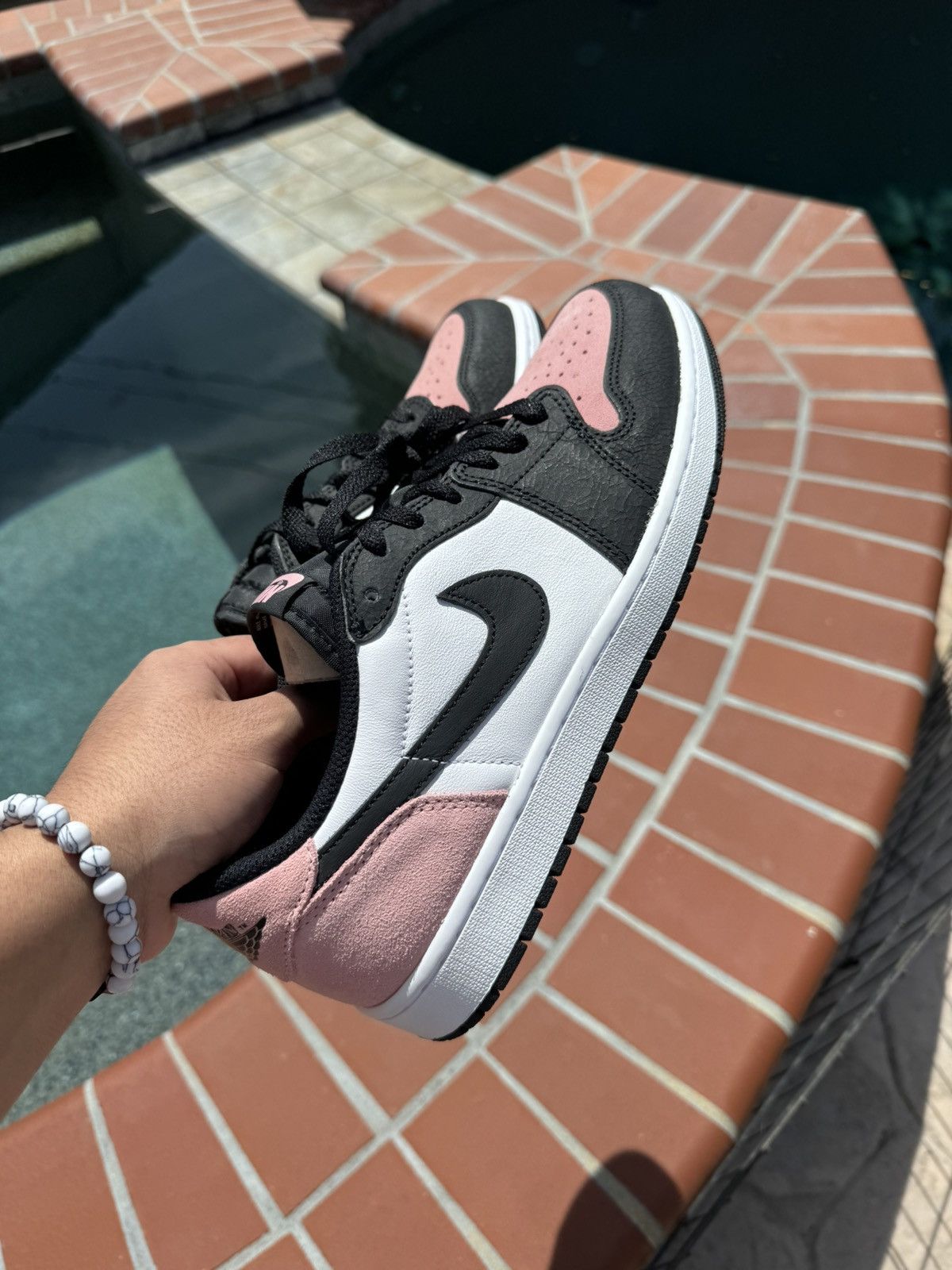 image of Jordan Nike Air Jordan 1 Low OG Shoes in Pink, Men's (Size 11)