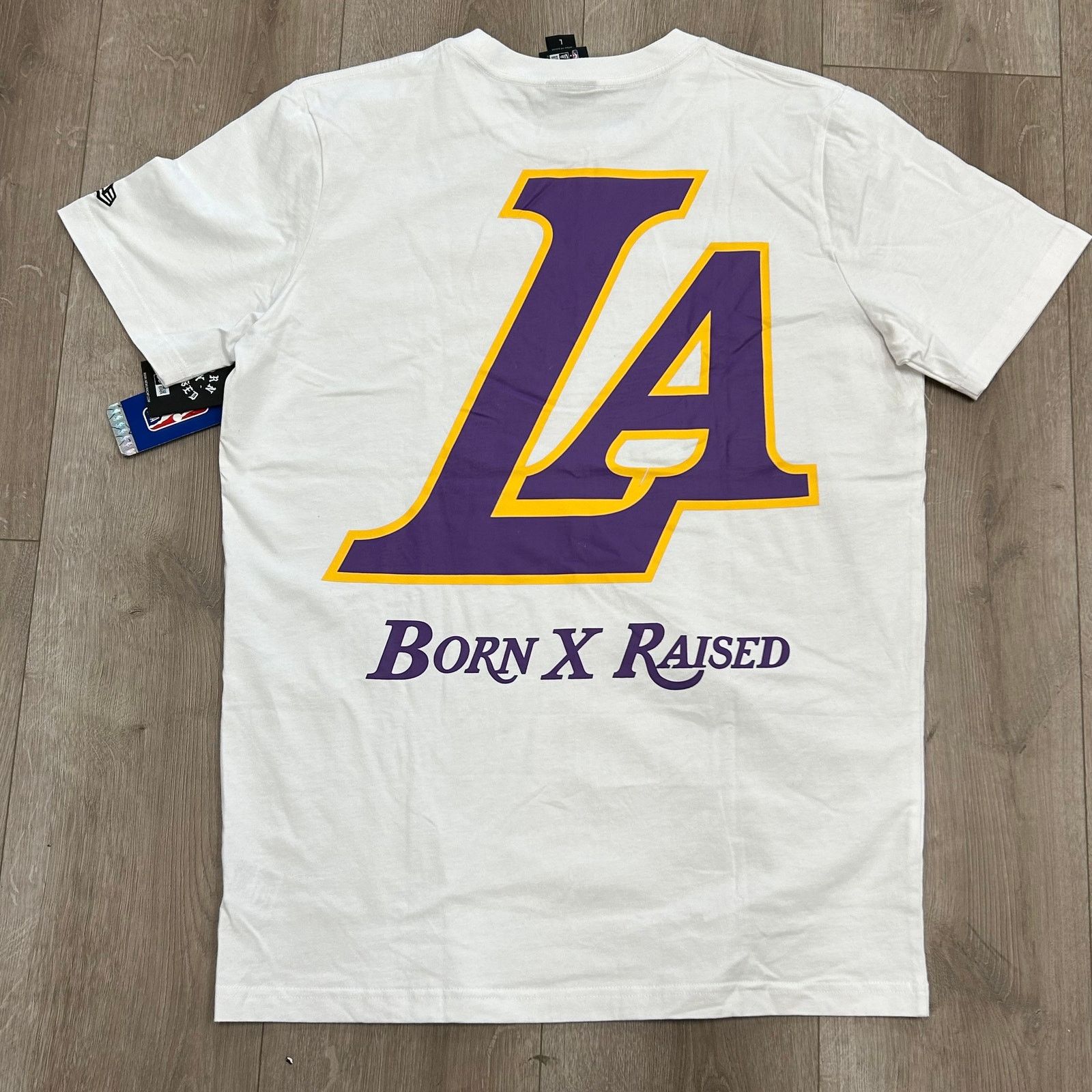 New Era New Era Born x Raised Los Angeles Lakers Tee T Shirt size L Size US L / EU 52-54 / 3 - 5 Thumbnail