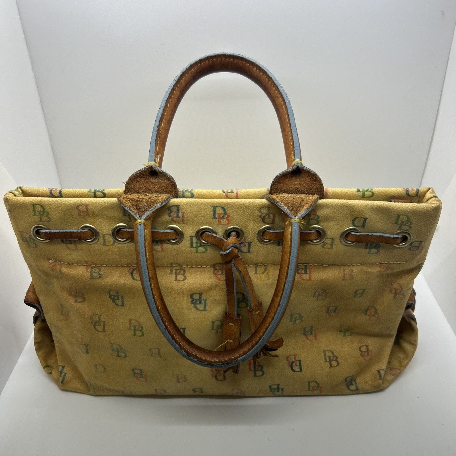 Dooney & Bourke Dooney & Bourke Pale Yellow& Tan Vinyl Handbag Purse Leather Size ONE SIZE - 1 Thumbnail