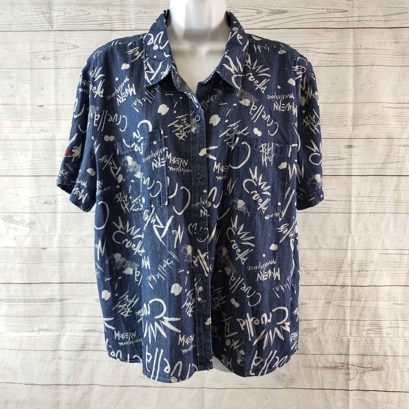 Disney Disney Womens Button Front Shirt XL Blue Chambray Denim Short Sleeve Cruella Theme Size XL / US 12-14 / IT 48-50 - 2 Thumbnail