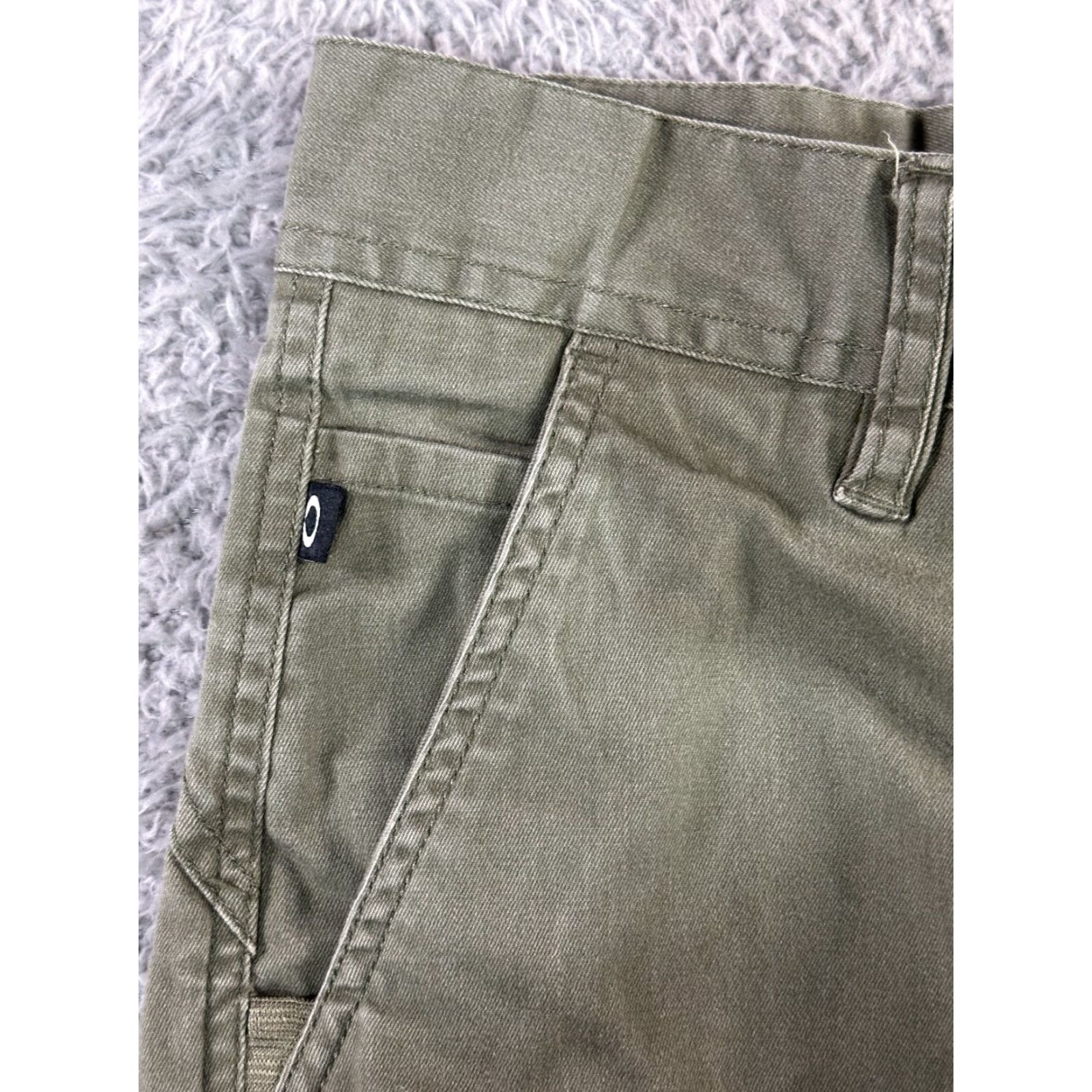 Oakley Oakley Pants Mens Olive Green Stretch Tapered Elastic Cuffs Size 28 Front Flat Front Zipper Logo Belt Loops 60/36/4 Elastane Casual Pants Size US 28 / EU 44 - 5 Thumbnail