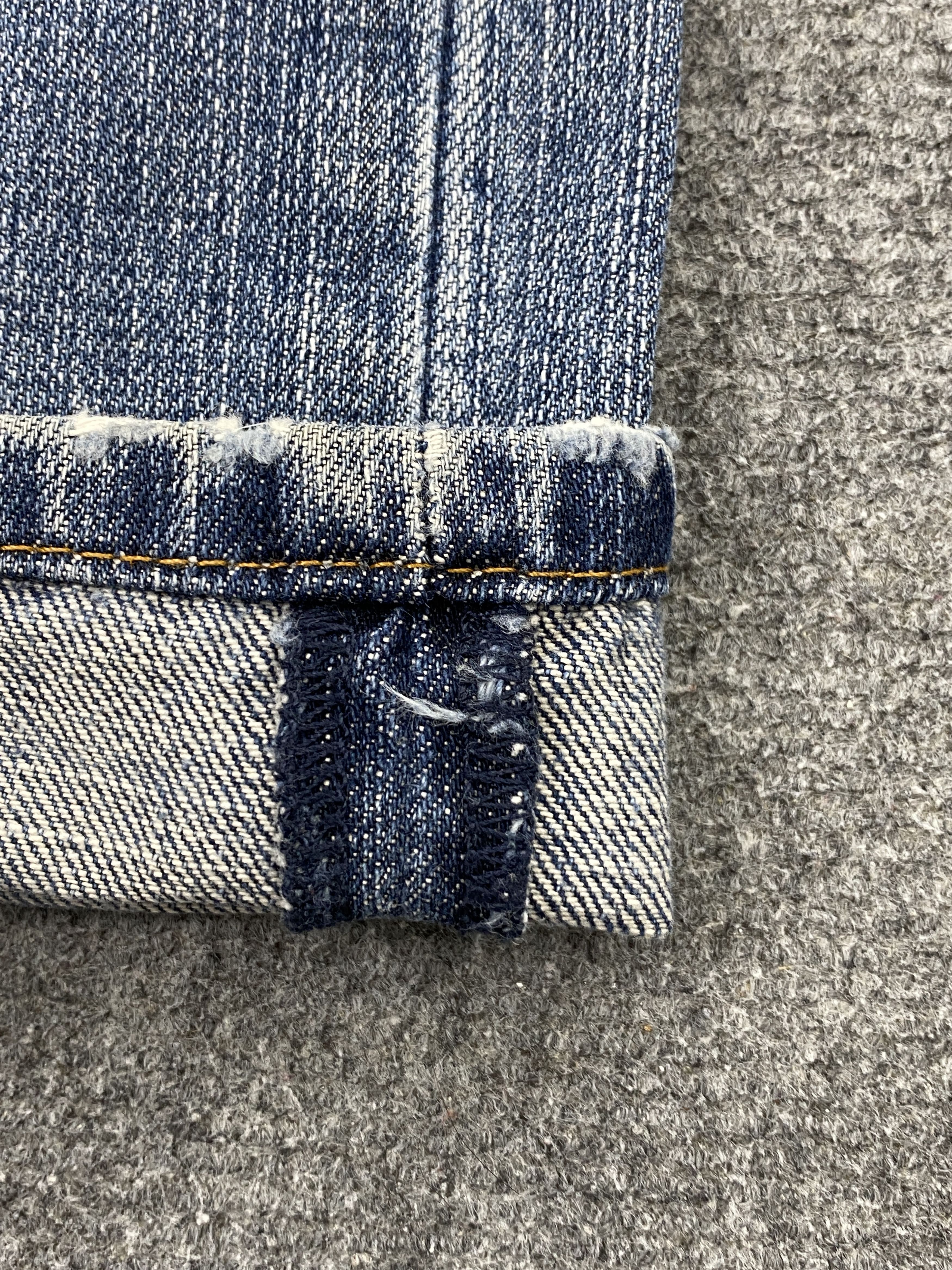 Distressed Vintage Levi's 505 Faded Blue Jeans