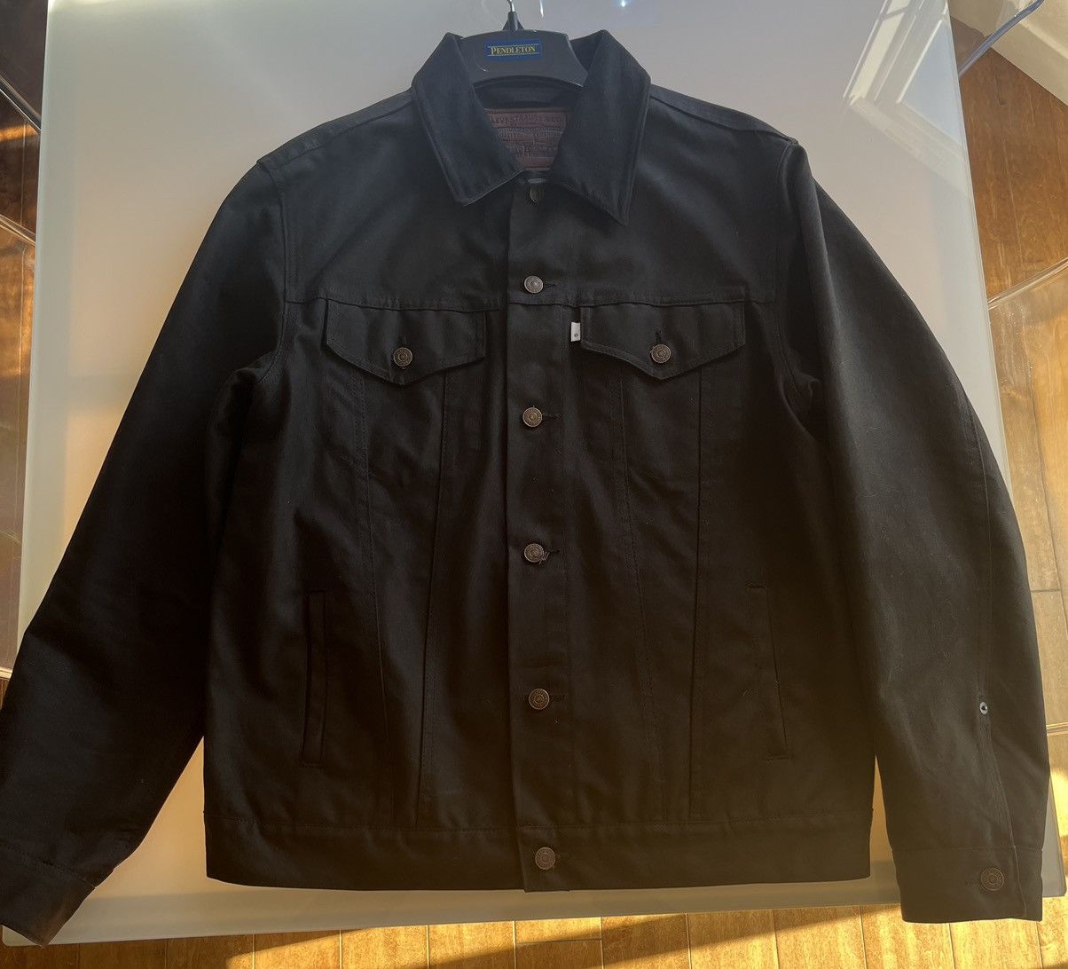 Levi's Rare Filson x Levi’s waxed trucker jacket in black, XL | Grailed