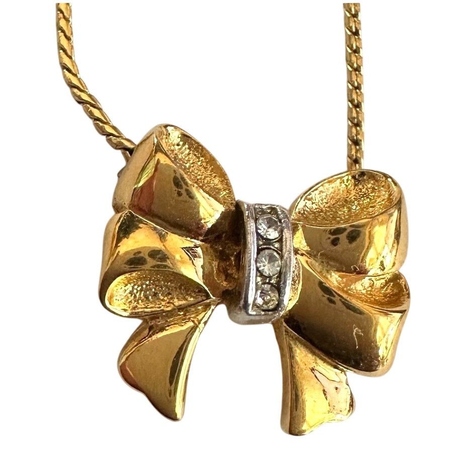 Yves Saint Laurent Yves Saint Laurent Gold and Rhinestone Bow Necklace Size ONE SIZE - 1 Thumbnail