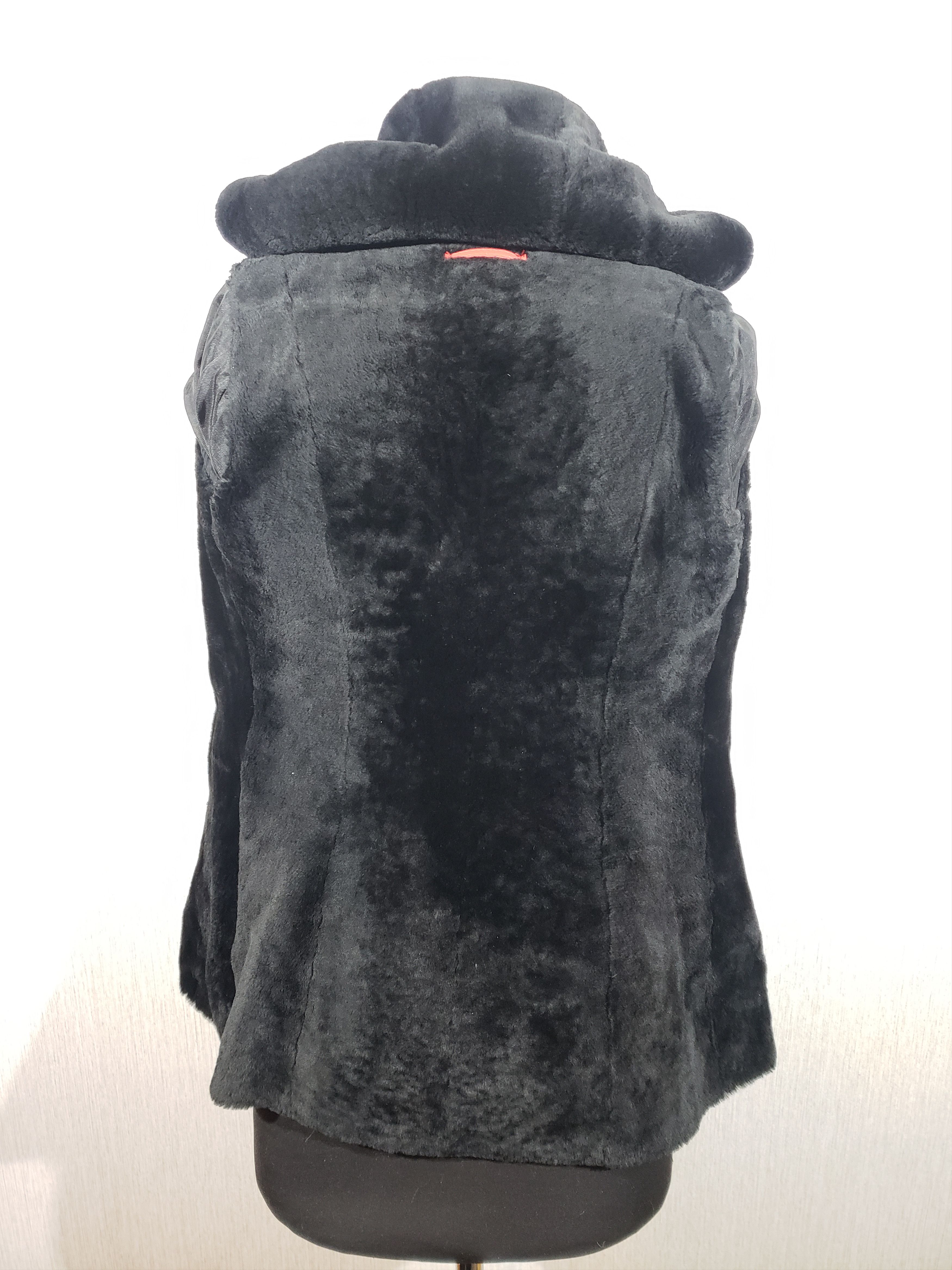 Stylish women's red sheepskin coat with a hood. Fur Faux Fur