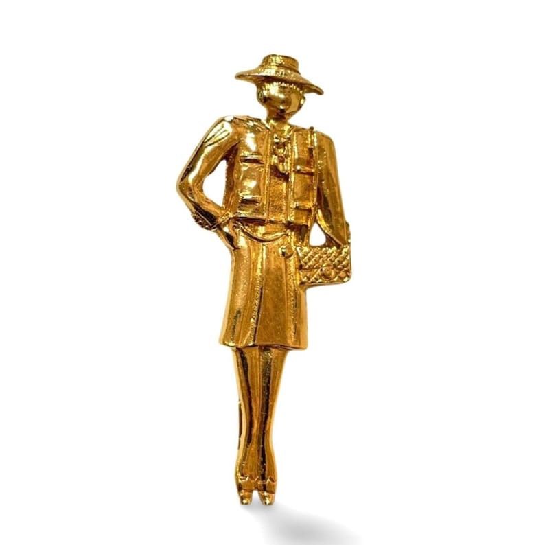 image of Chanel Vintage Gold Tone Brooch In Mademoiselle Figure, Women's